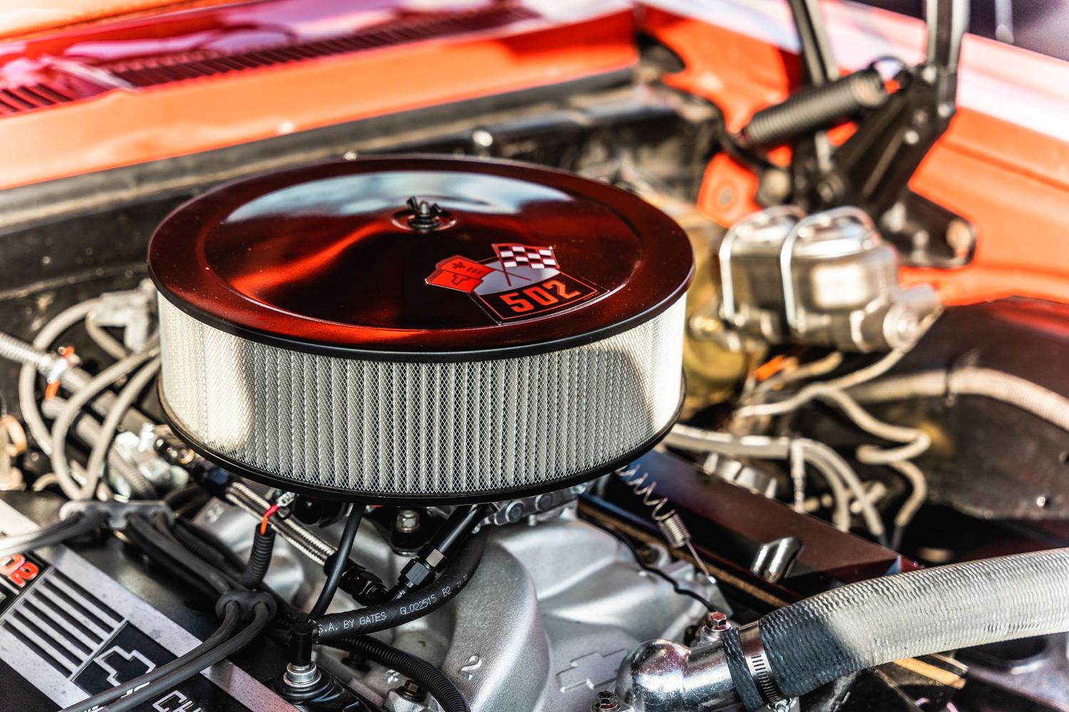 Chrome air filter assembly on restored classic car engine.
