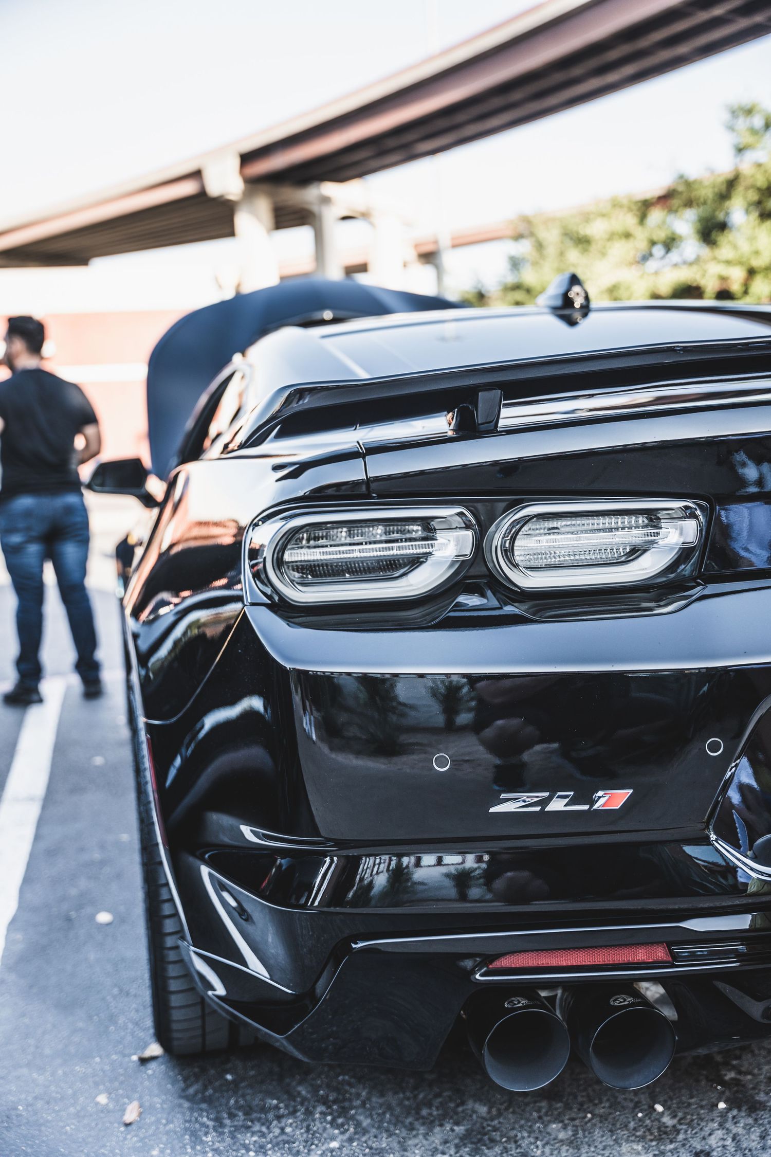 Close up of a black Camaro ZL1's rear end showing modern LED taillights.