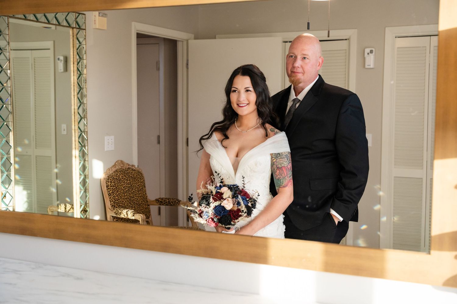 A reflection captured in an elegant mirror during wedding preparations.
