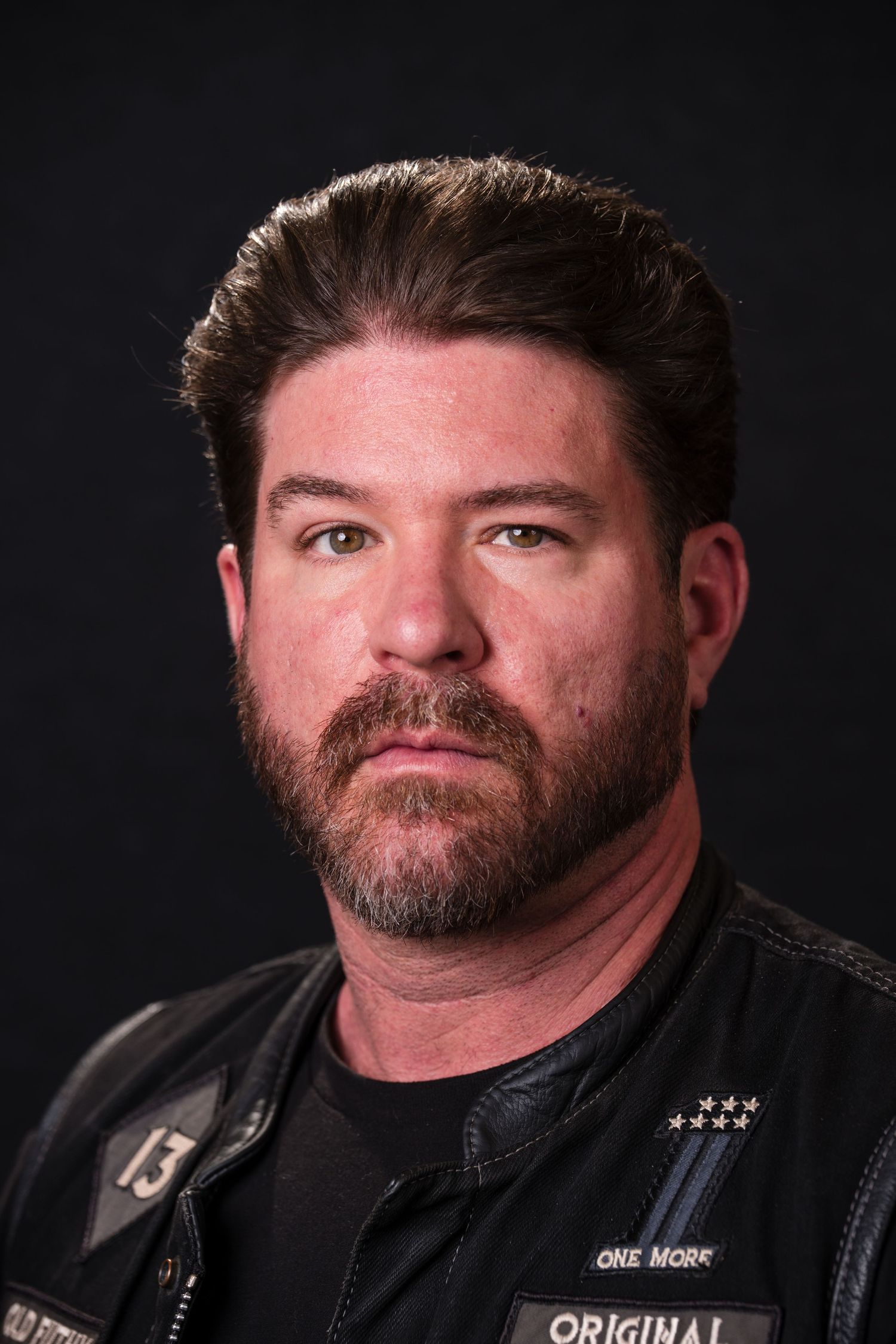 Portrait photo series showing a person in black leather jacket against dark background with dramatic lighting.