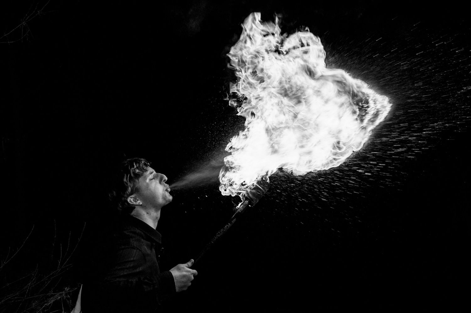 A series of black and white photos showing smoke being exhaled in dramatic lighting against dark backgrounds.