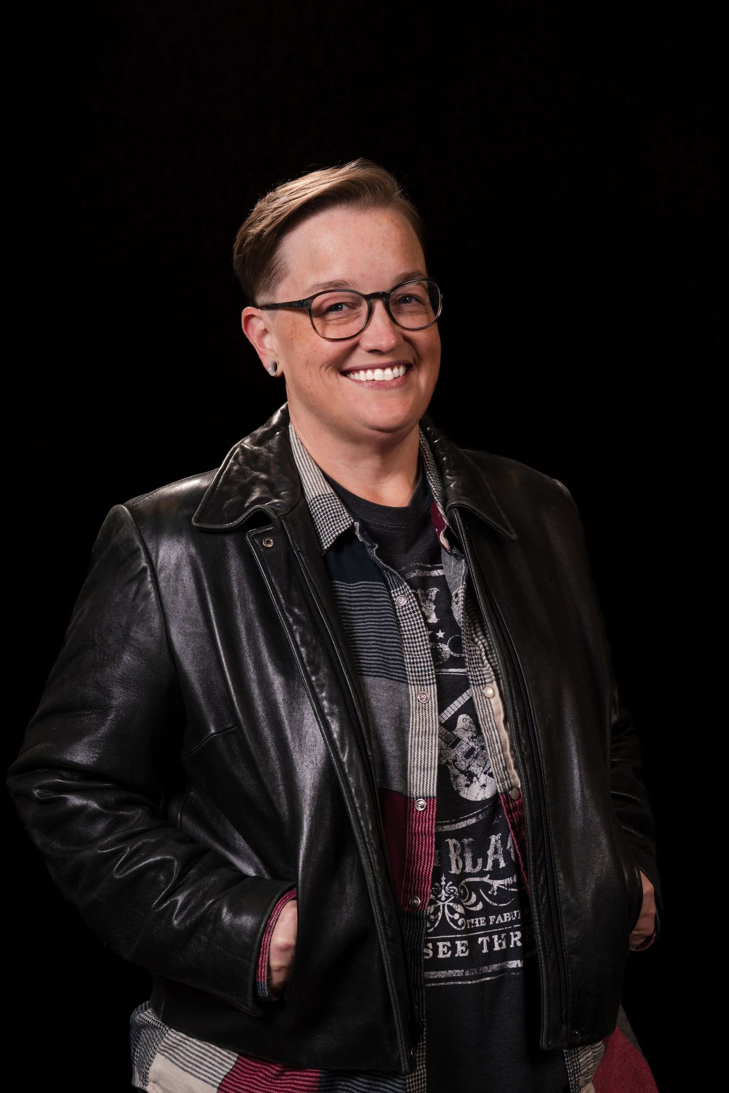 A series of black and white portraits showing someone in a leather jacket against a dark background.