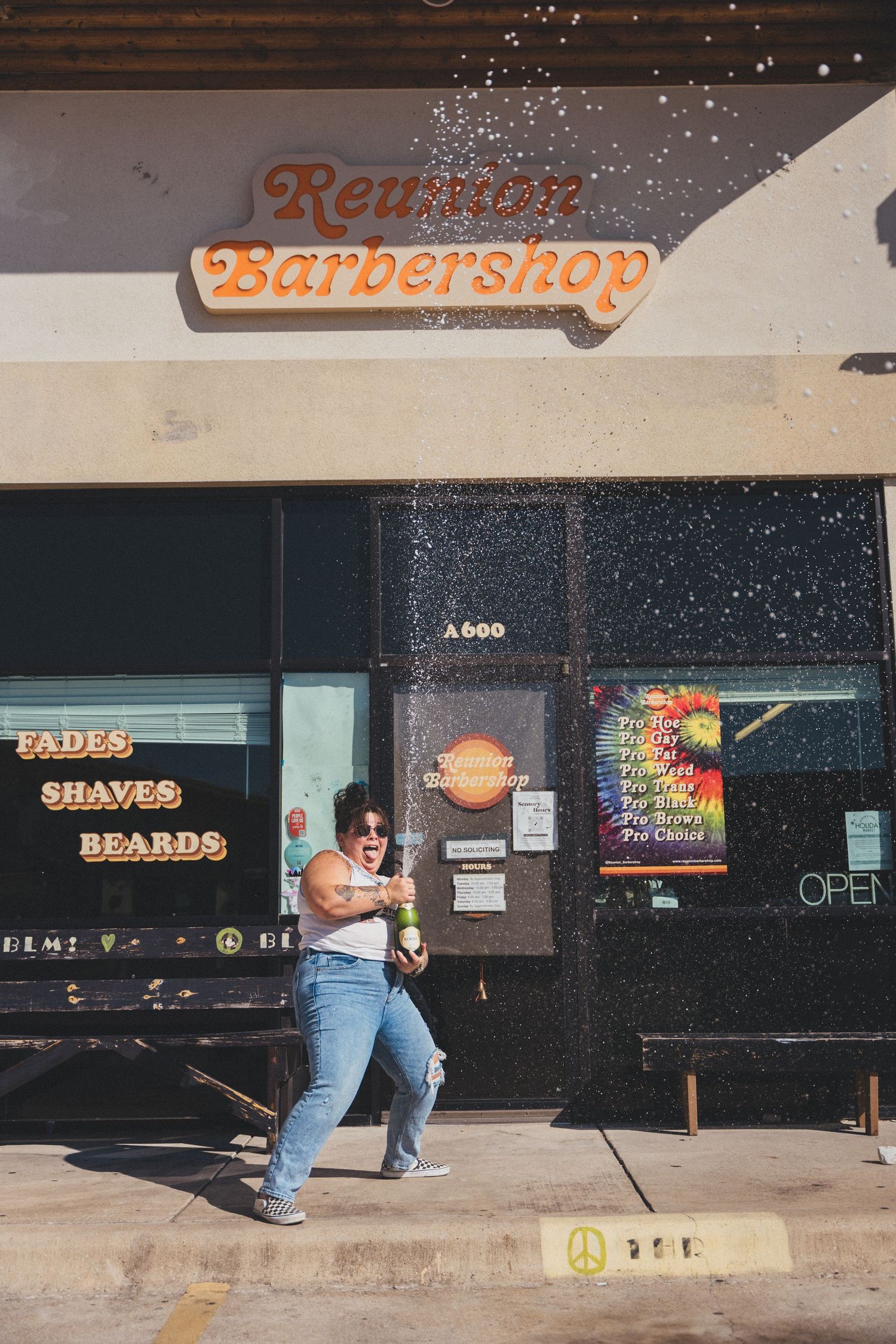 A panoramic sequence shows the exterior of a barbershop storefront with neon signs for shaves and beards at night.