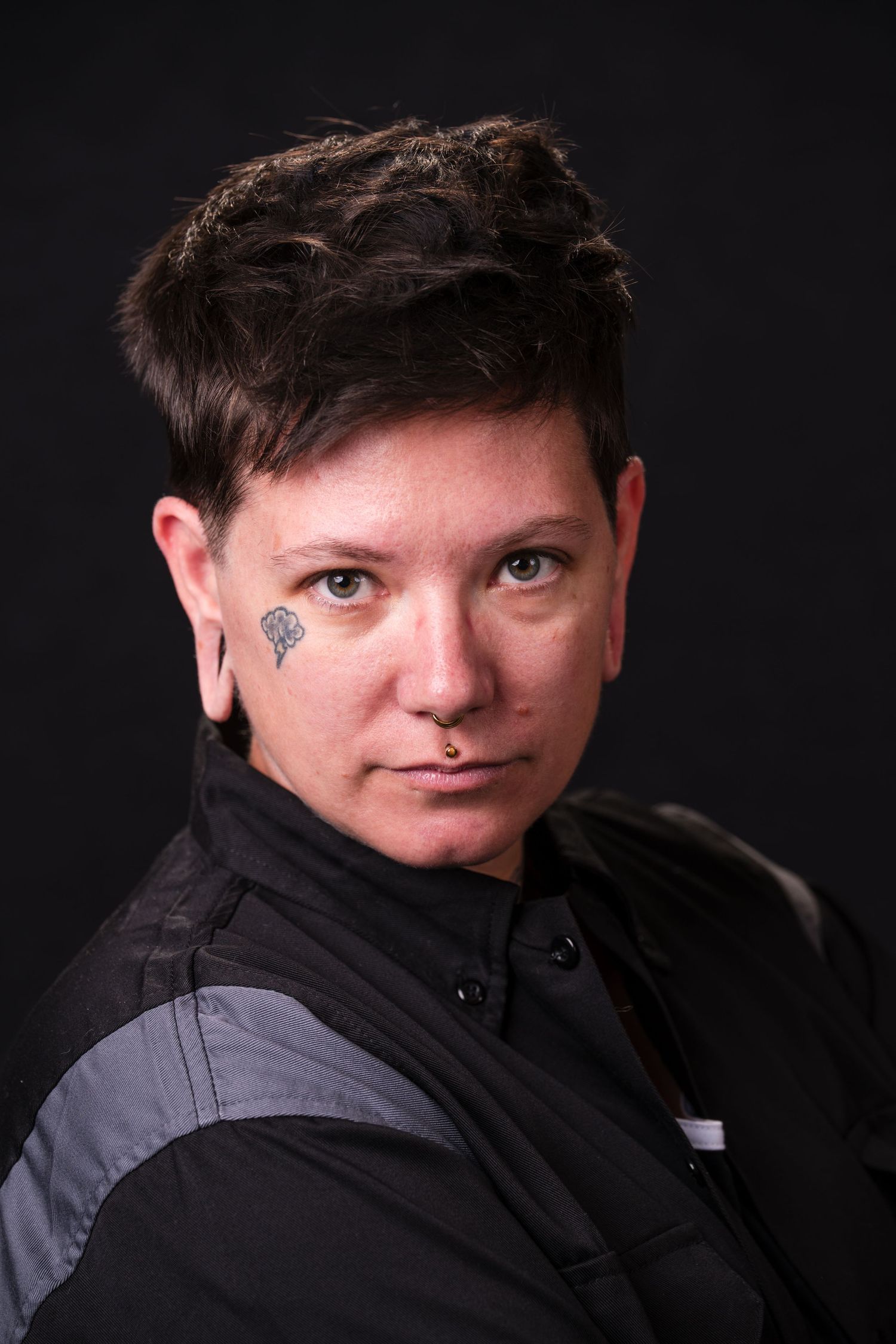 Professional headshot series against dark background showing different angles and expressions.