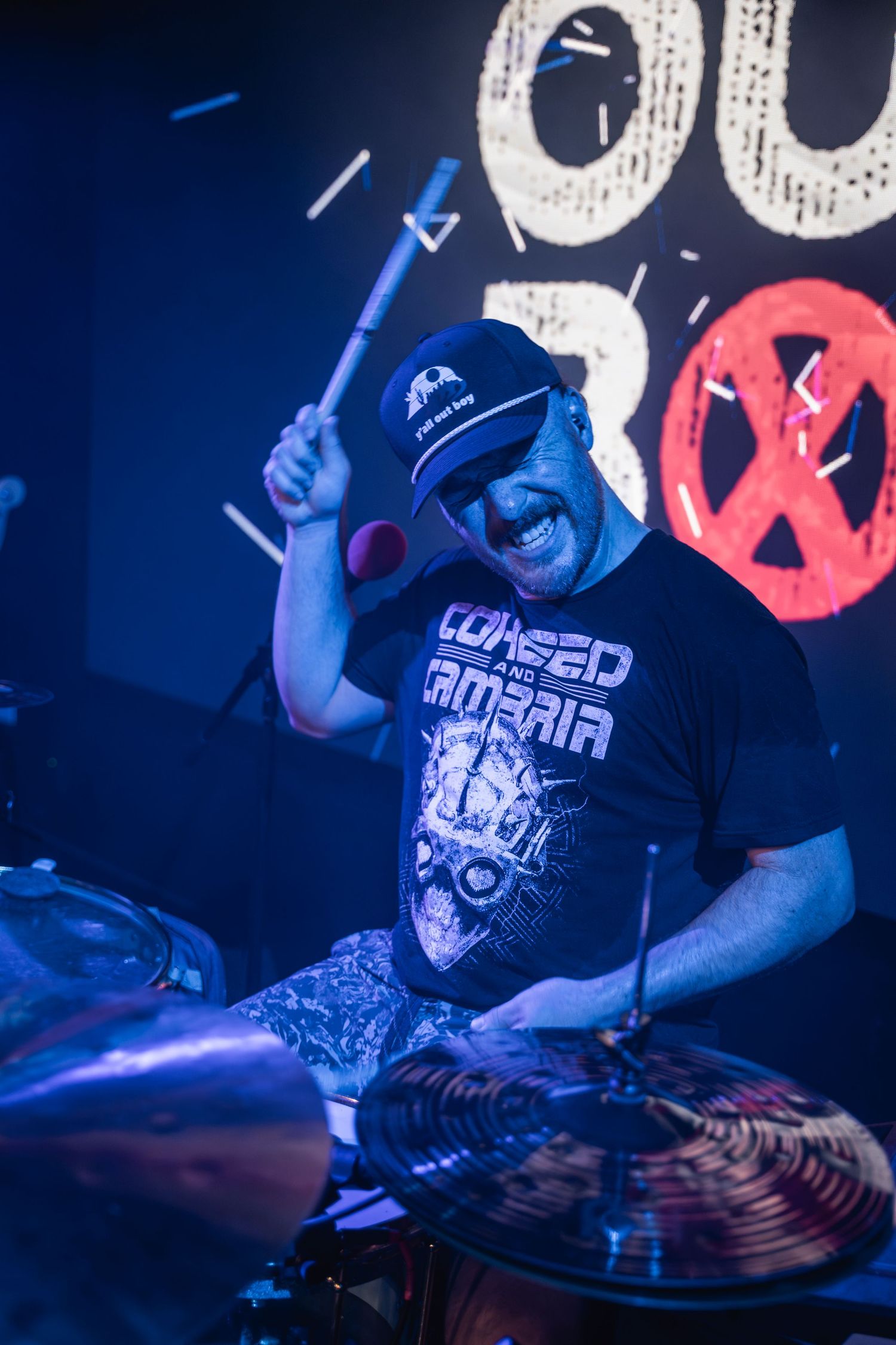 DJ performing at a nightclub with blue lighting and turntables, captured in a sequence of dynamic shots.
