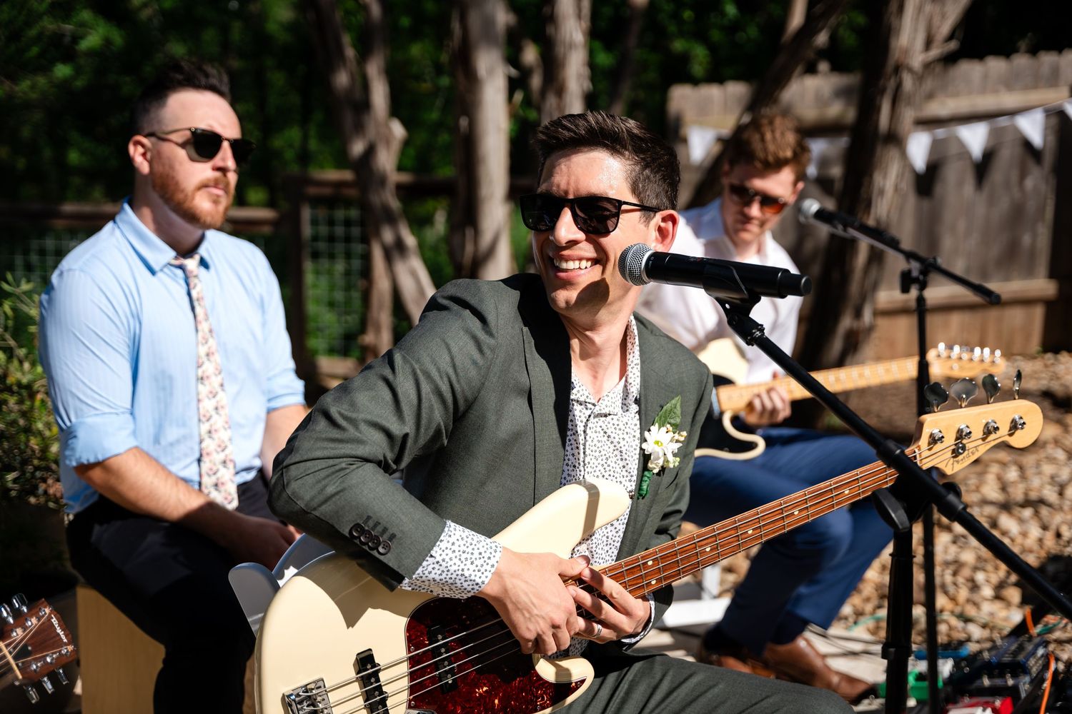 Wedding band performs live music at outdoor reception.