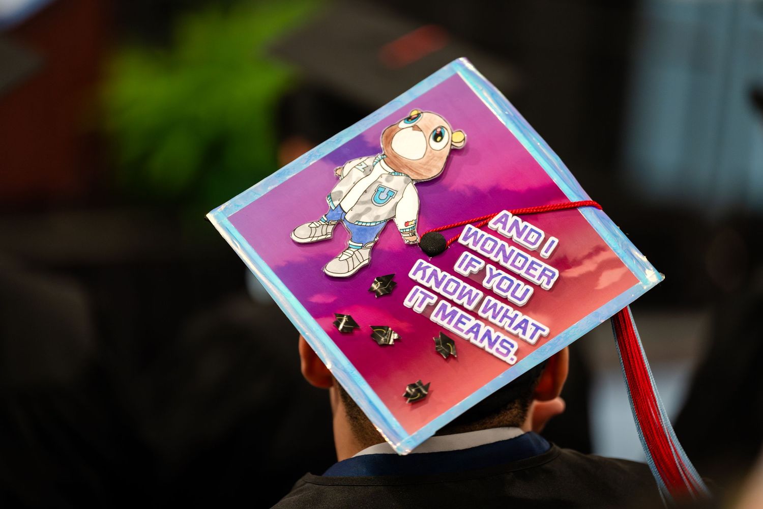 Graduation cap decorated with cartoon character and personal message.