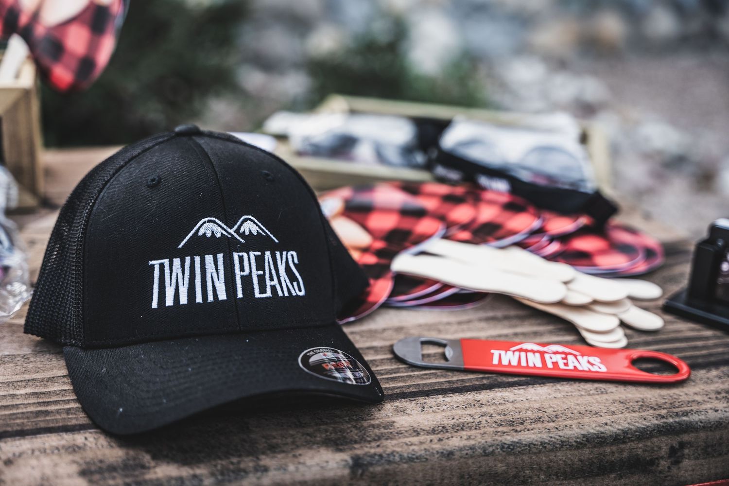 Close-up of black Twin Peaks branded baseball cap with mountain logo design.