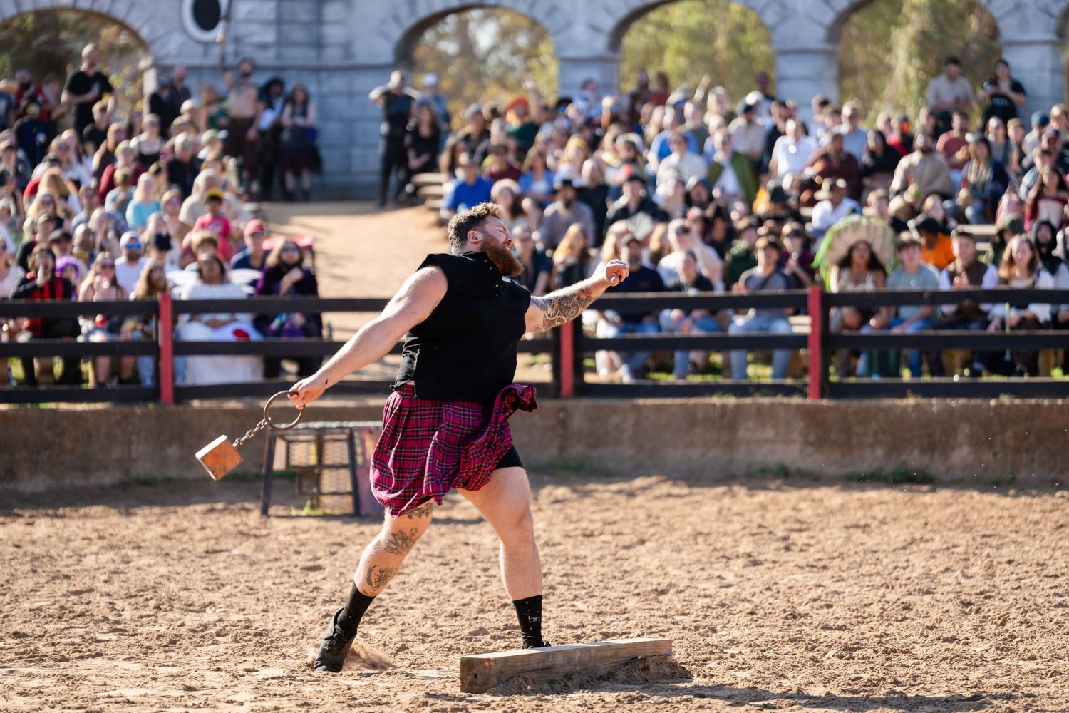 Medieval jousting tournament competitors battle on horseback at a historical reenactment event.