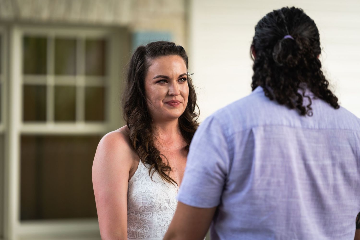 A tender moment captured between a couple during what appears to be a wedding ceremony.