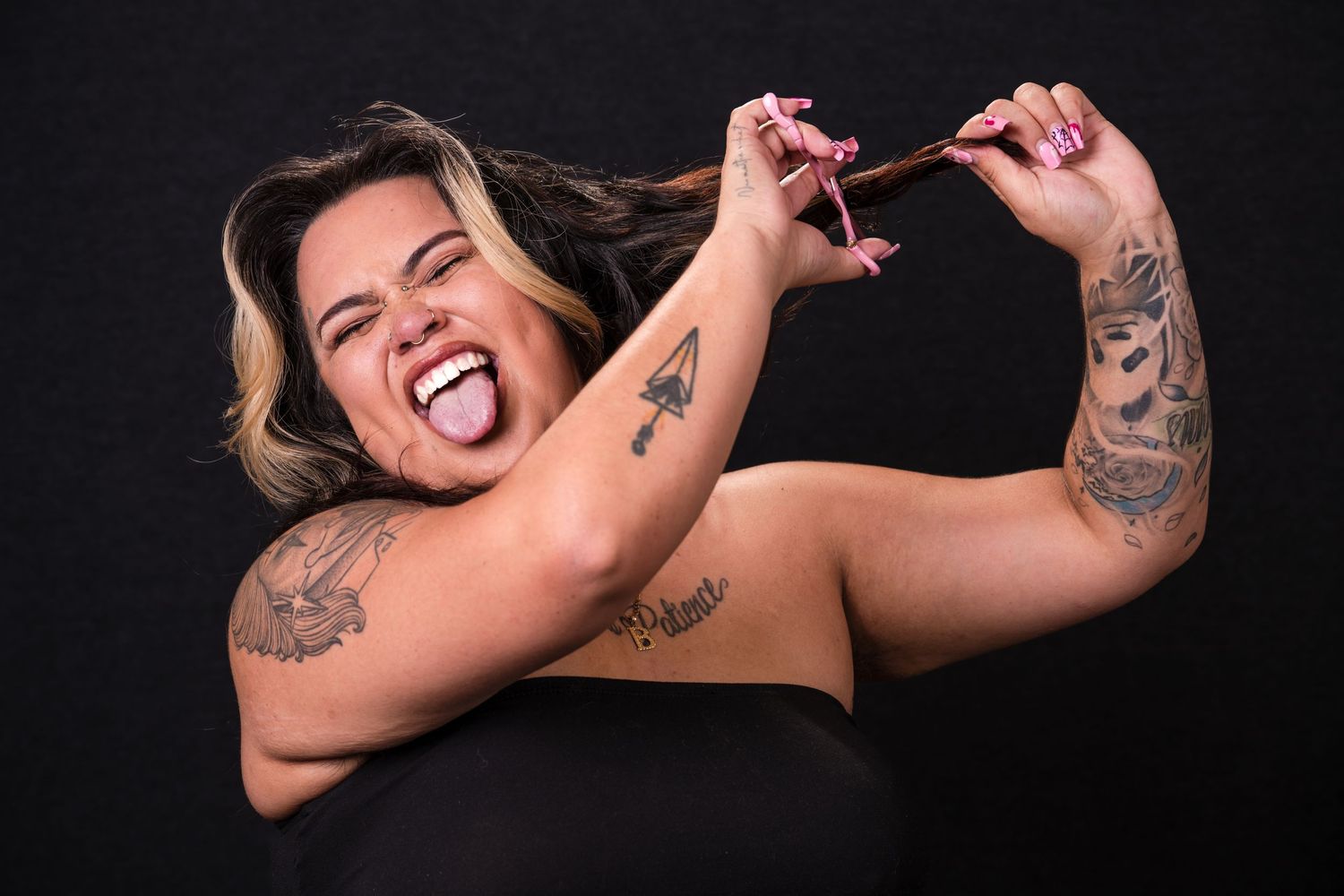 Artistic black and white photos showing tattoos and creative poses against a dark backdrop.