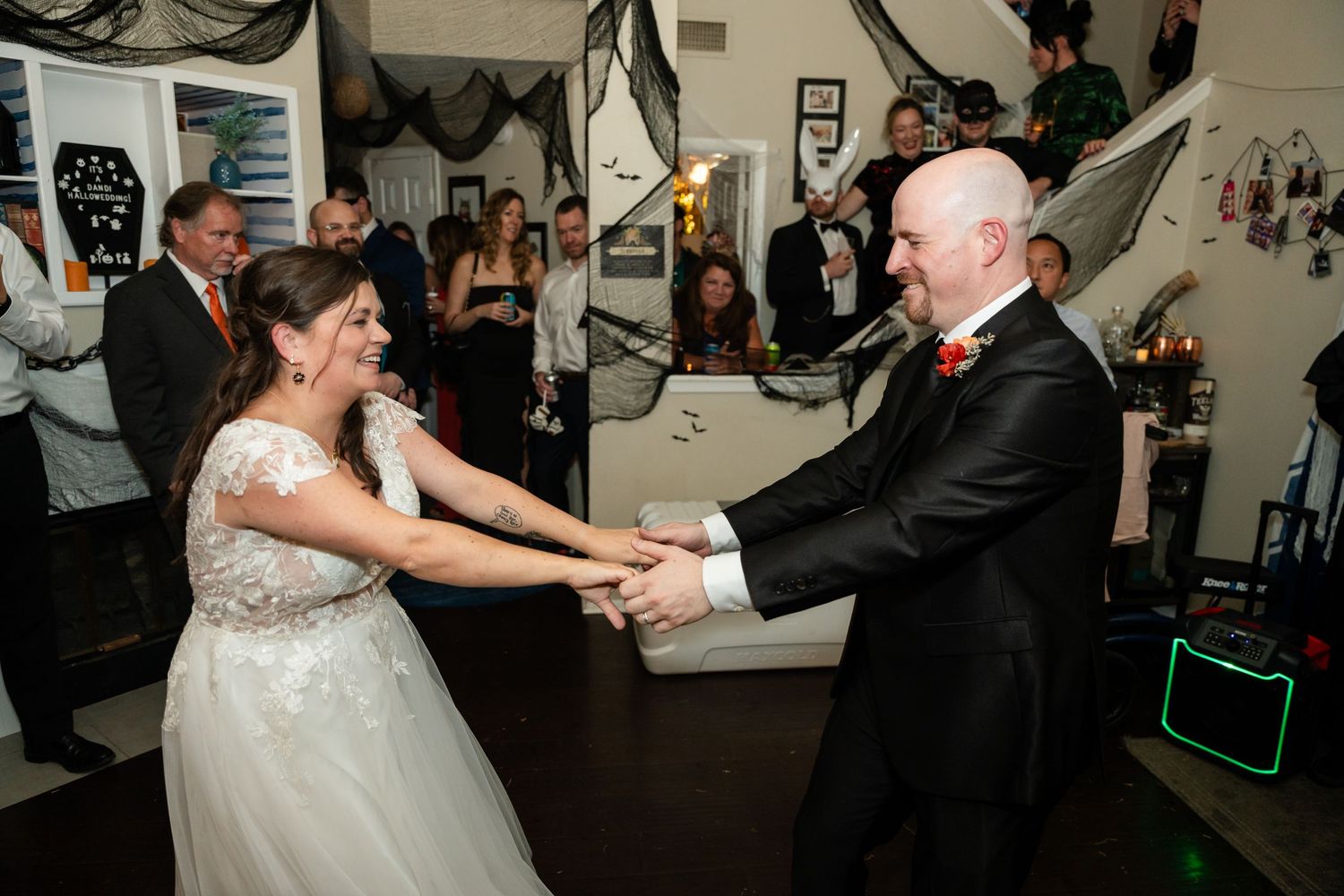Dancing at a wedding reception decorated with black and white decor.