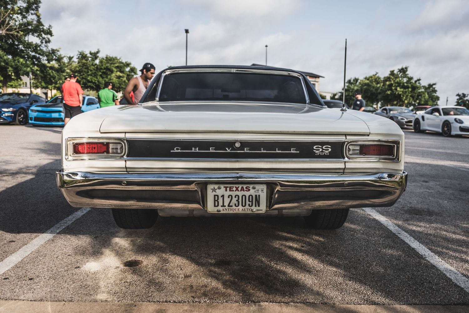 Rear view of classic Chevelle SS showing taillights and chrome bumper in parking lot.