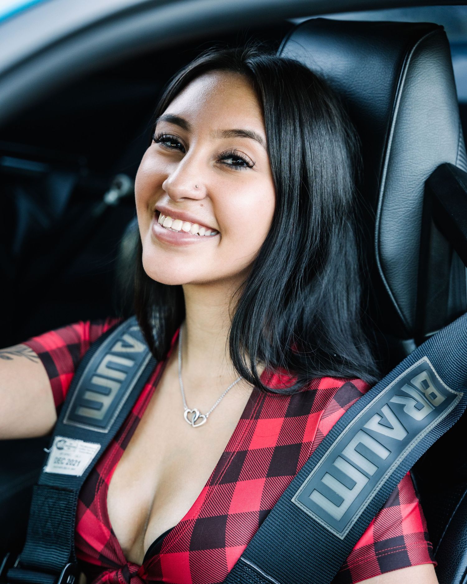 Interior car photo showing racing seats with UNIT harnesses.