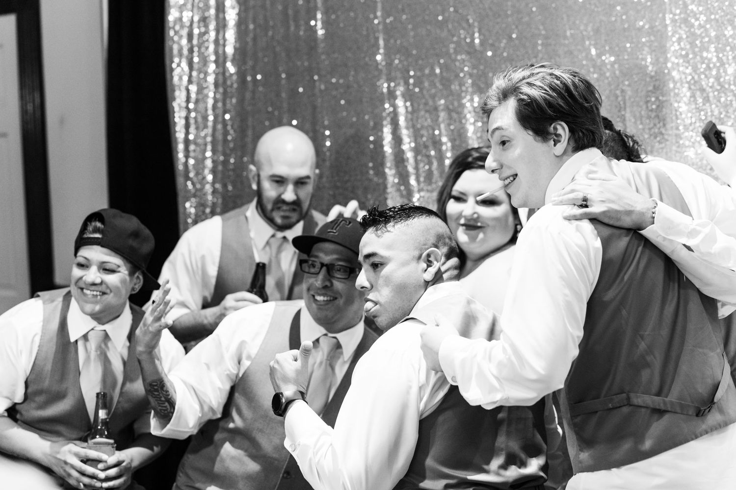 Vintage black and white photograph of people gathered at a formal event.