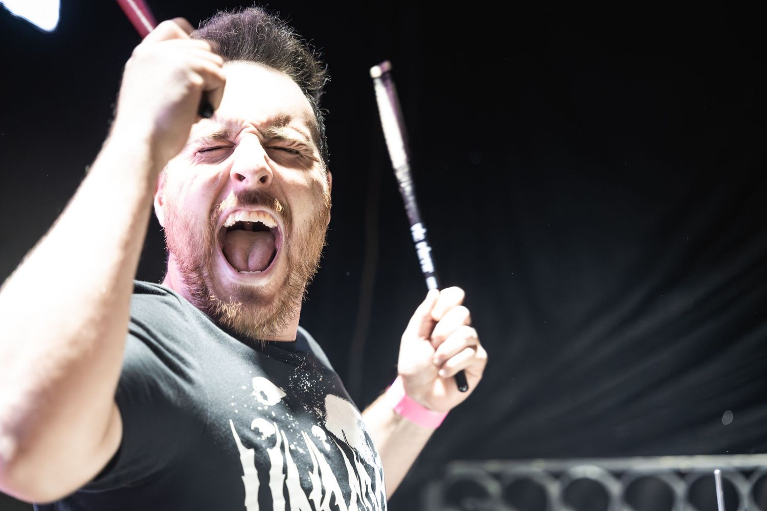 Performer shows intense emotion during passionate stage performance.