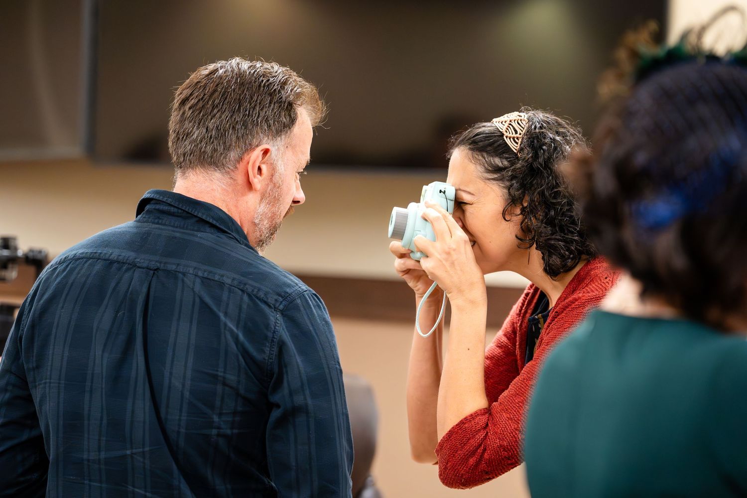 An emotional moment captured during a courthouse ceremony with someone wiping away tears.