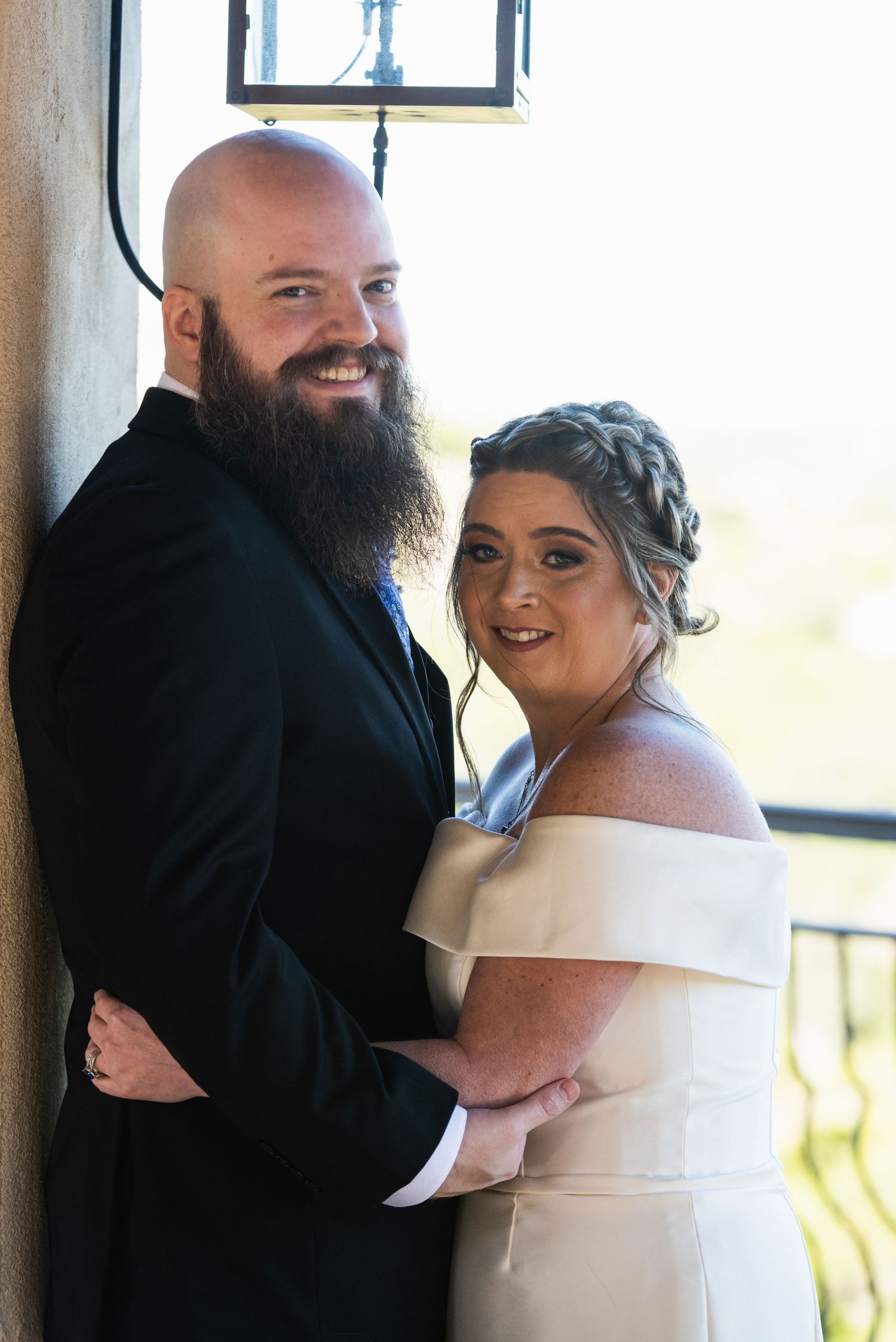 A couple embraces during their wedding photoshoot.