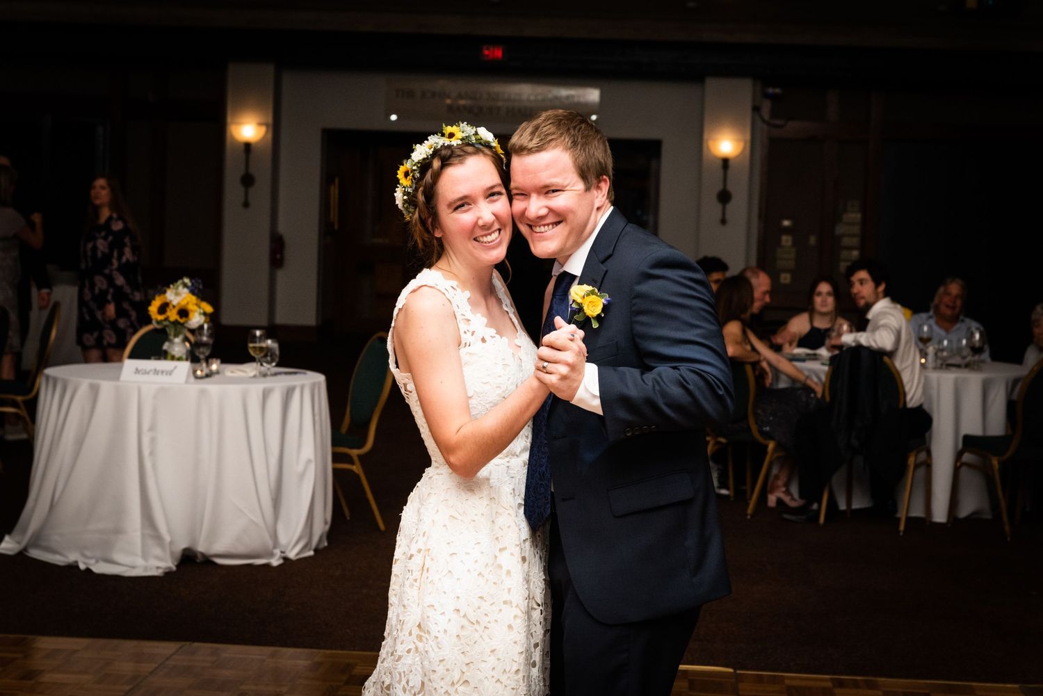 A couple shares their first dance at their wedding reception.