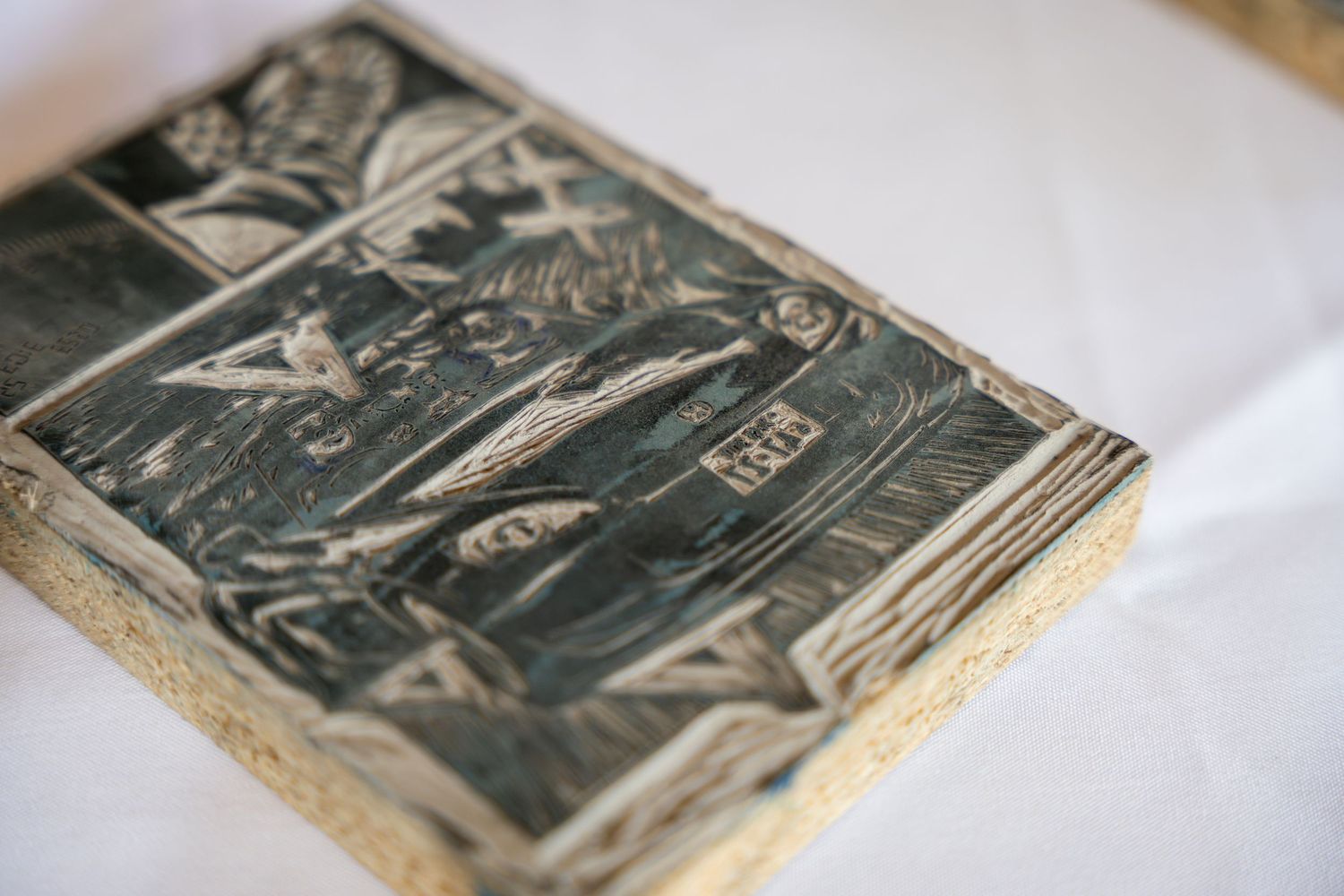 Close-up view of an old antique book page showing detailed black and white woodcut or engraved illustration.
