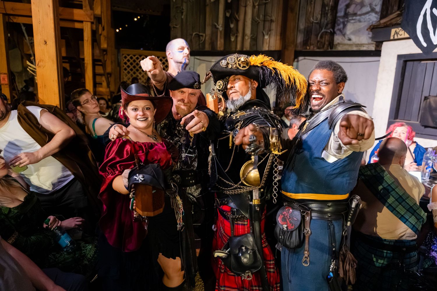 A lively crowd of musicians performing with brass instruments and drums during a festive celebration.