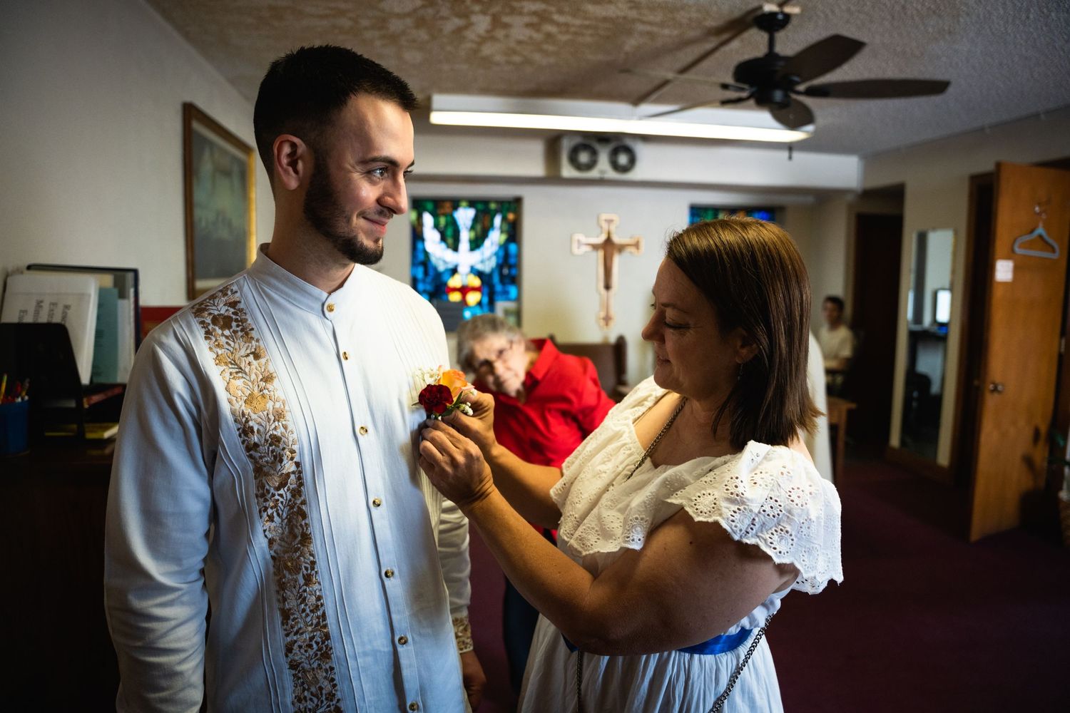 A religious ceremony preparation scene in a church interior.