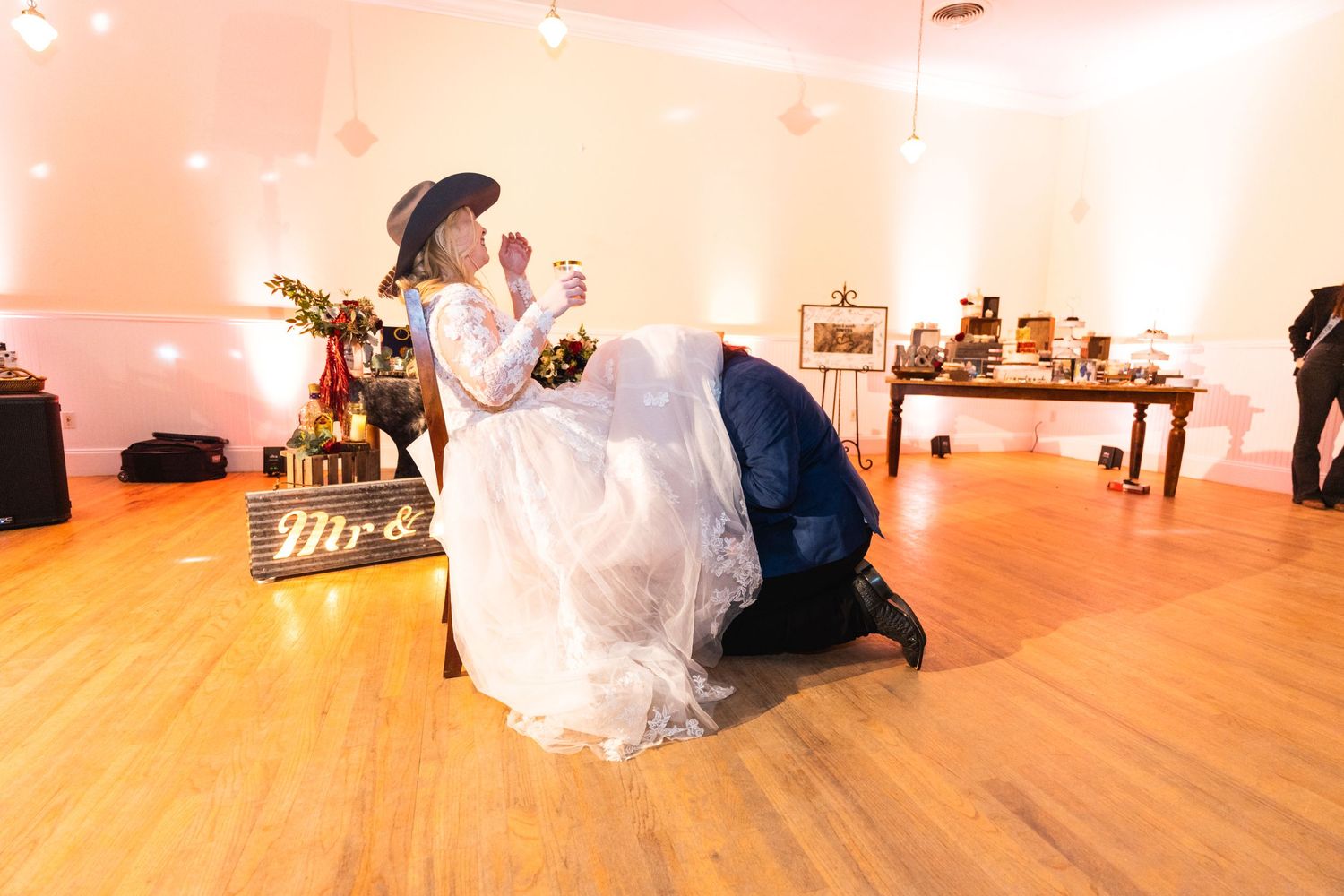 A couple shares a romantic moment on the dance floor during their wedding reception.
