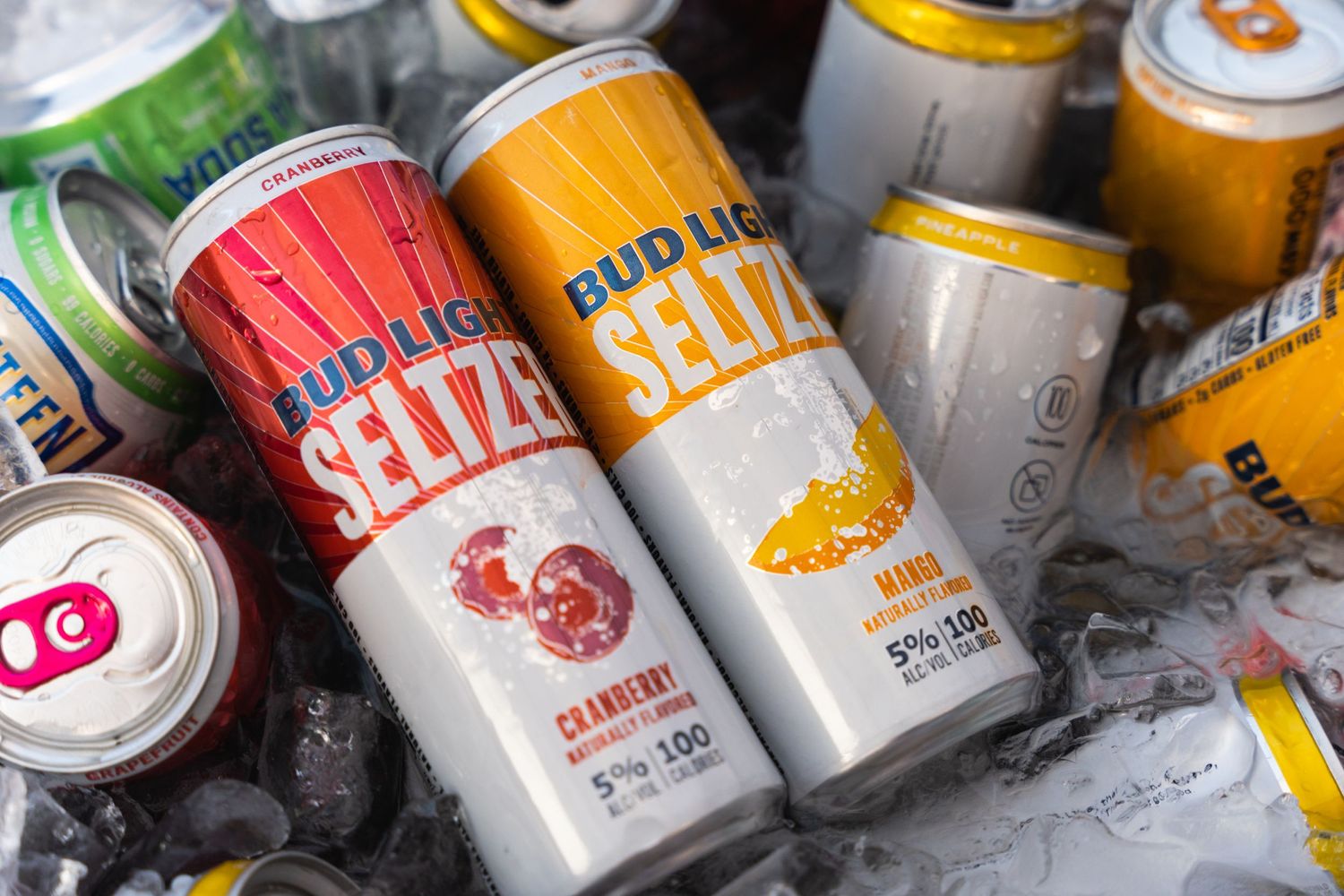 Closeup of colorful Bud Light Seltzer cans nestled in ice.
