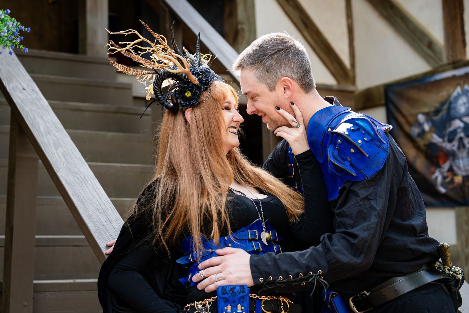 A couple in formal attire shares an intimate dance moment at an indoor wedding reception.