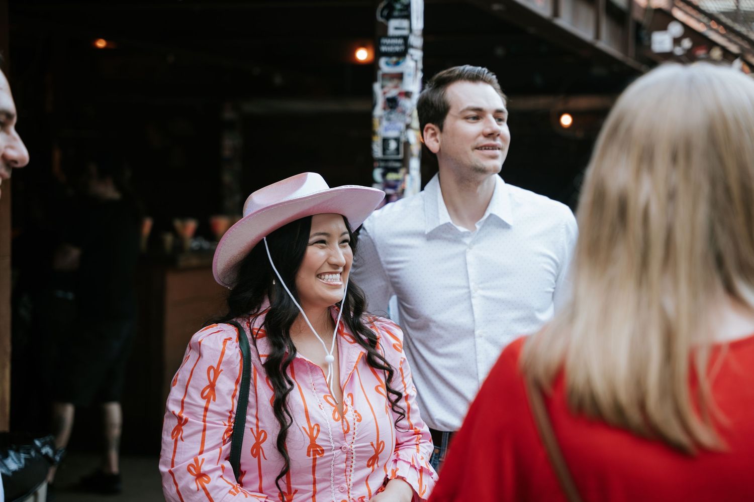 Casual outdoor gathering with western-themed attire.