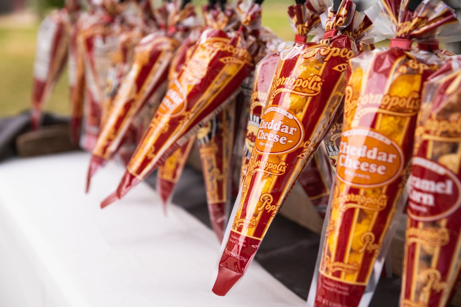 Rows of packaged snacks displayed at an outdoor event.