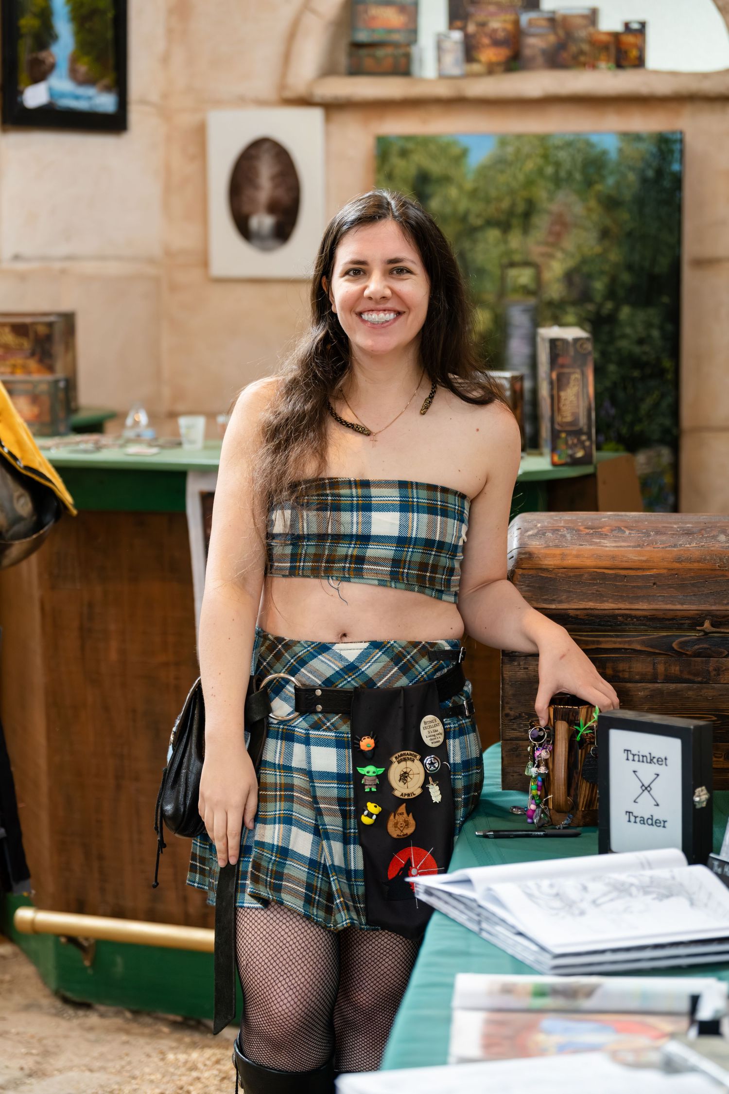 A series of photos showing someone in a plaid dress and fishnet stockings posing with vintage items and books.