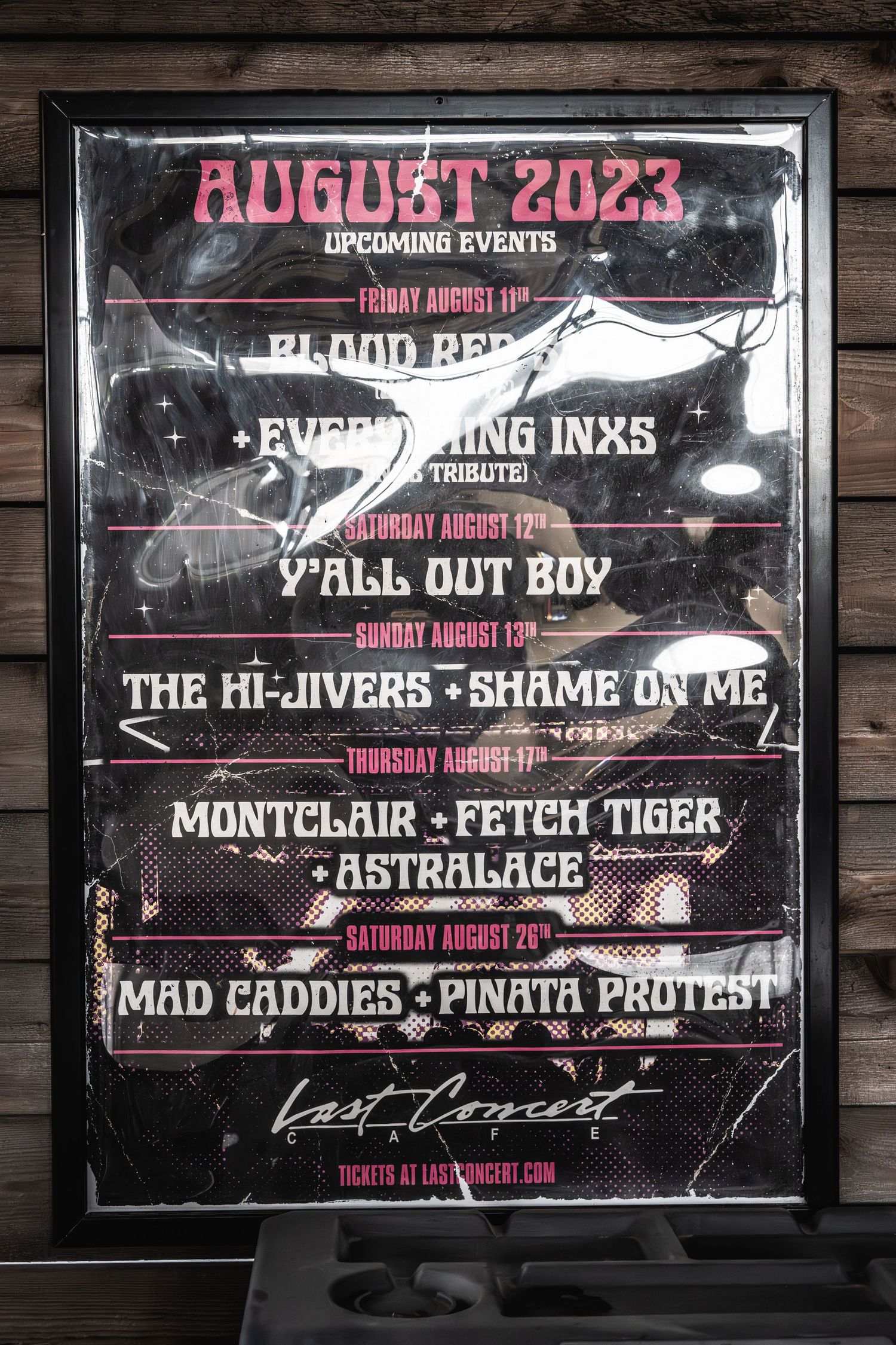 Black and pink concert poster displaying August 2023 lineup of tribute bands.
