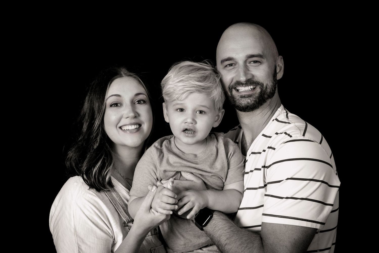 Black and white studio portrait with toddler.