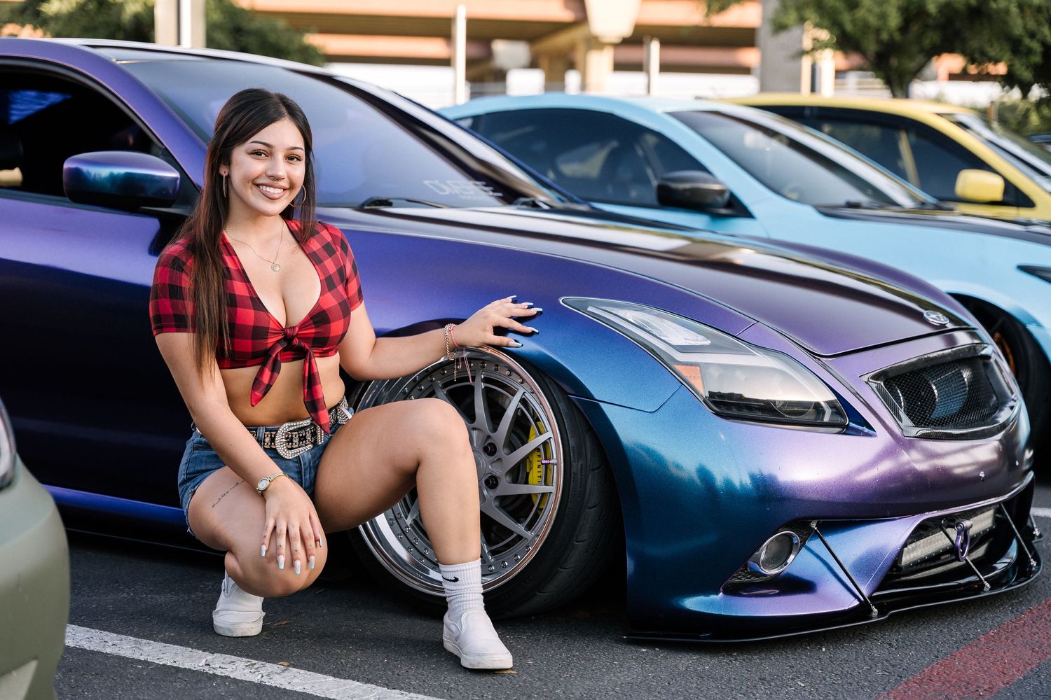 Custom Infiniti G37 with aftermarket modifications and metallic blue paint at a car meet.