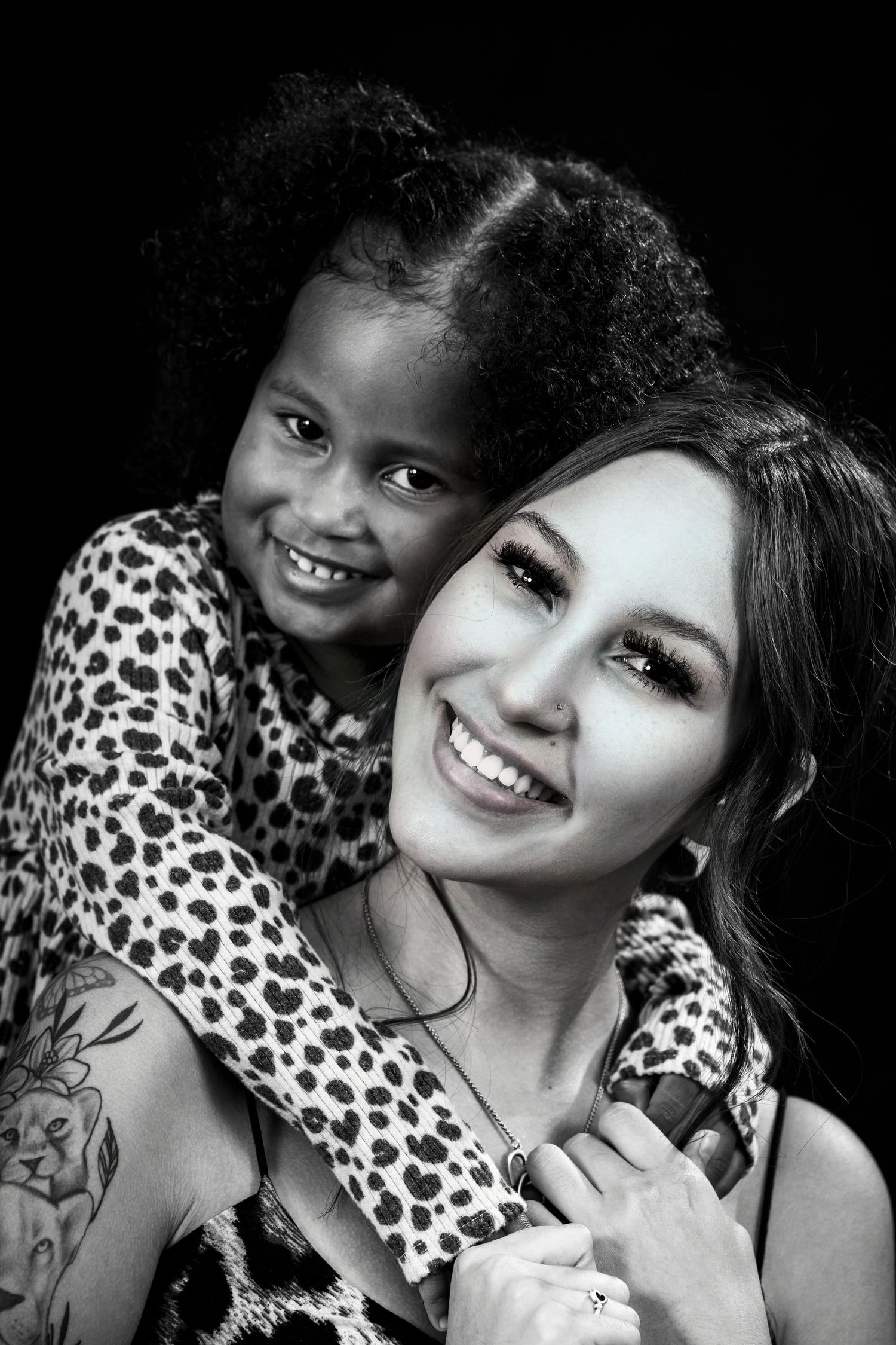 Black and white portrait showing genuine joy and connection between two people.