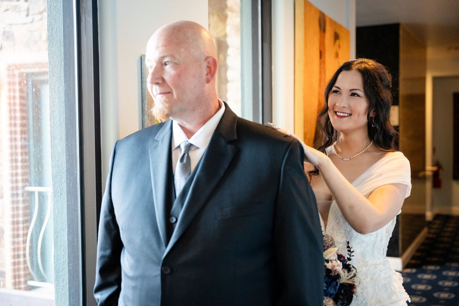 A sweet emotional moment captured during a wedding first look.
