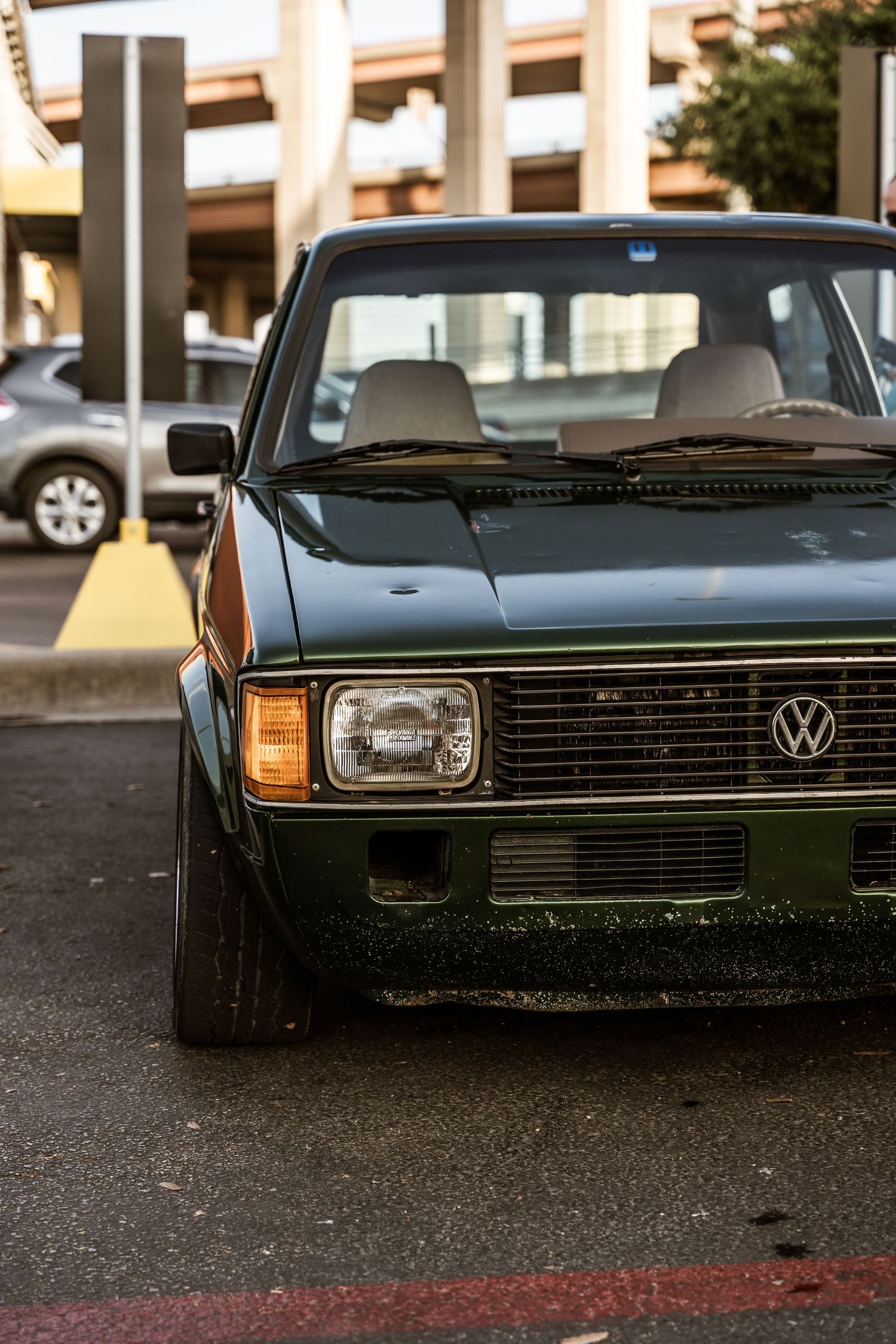A classic Volkswagen Rabbit front end showing square headlights and black grille.