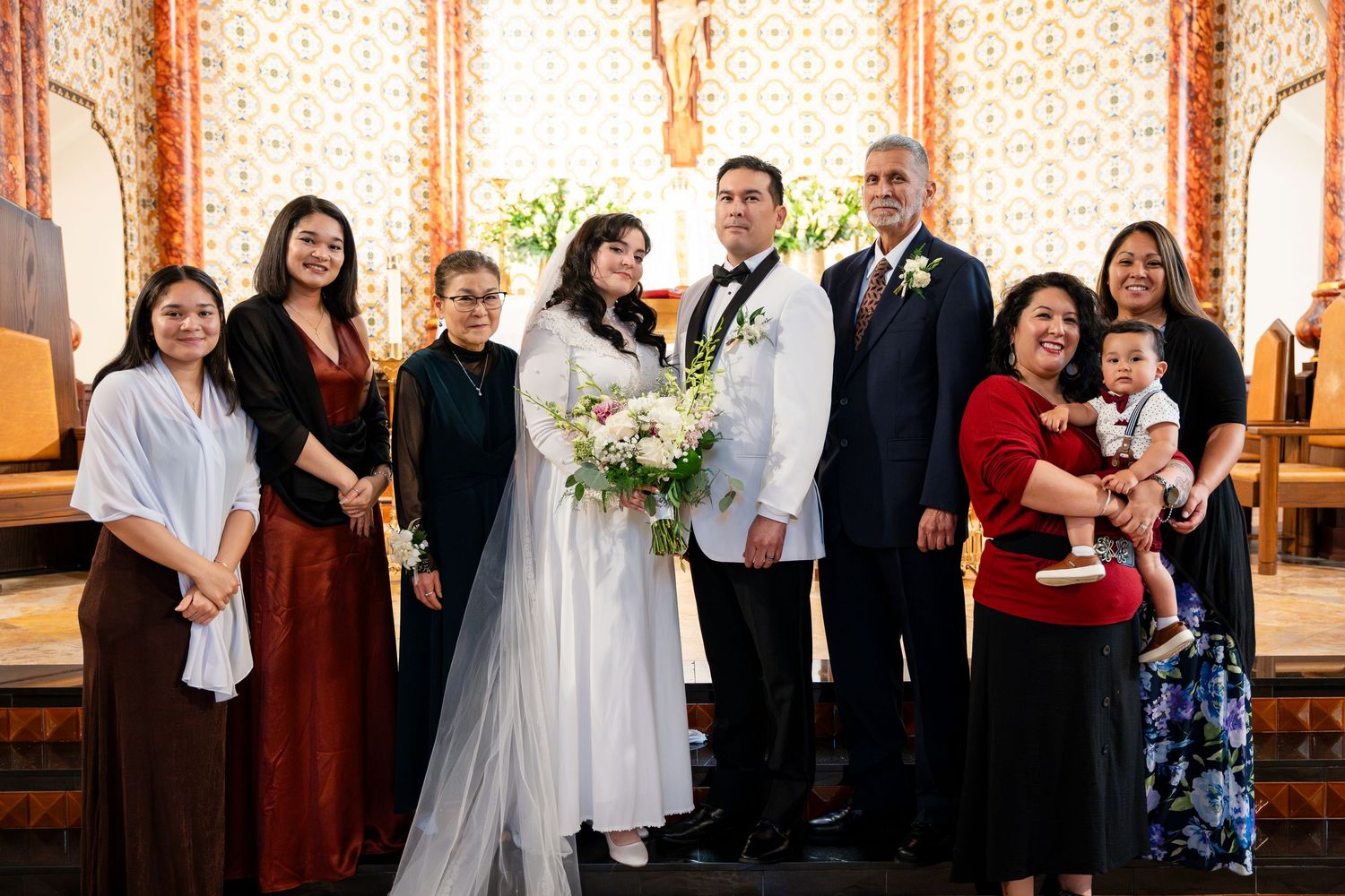 Modern wedding ceremony scene inside a church with guests and attendees in formal attire.