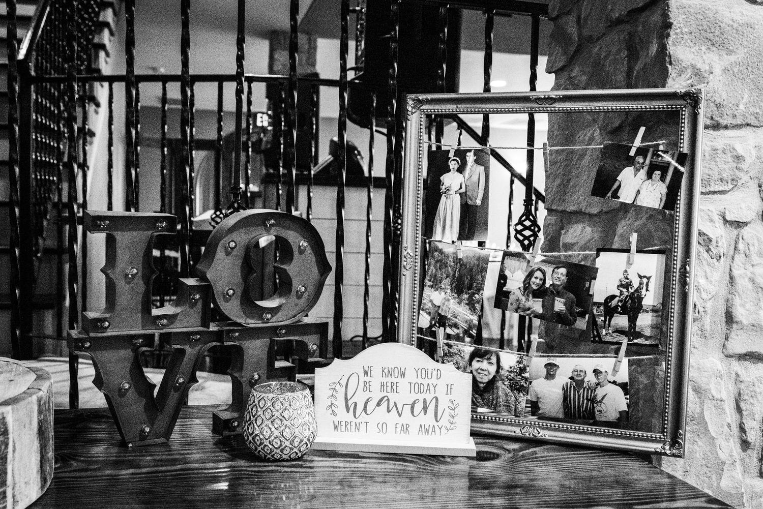 Black and white display of vintage decor with LOVE letters and photo frames.