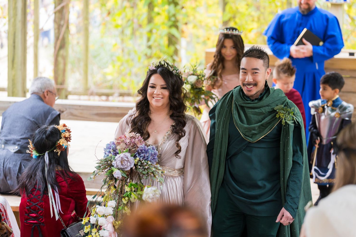 Wedding guests enjoying candid moments and conversations during an outdoor reception celebration.