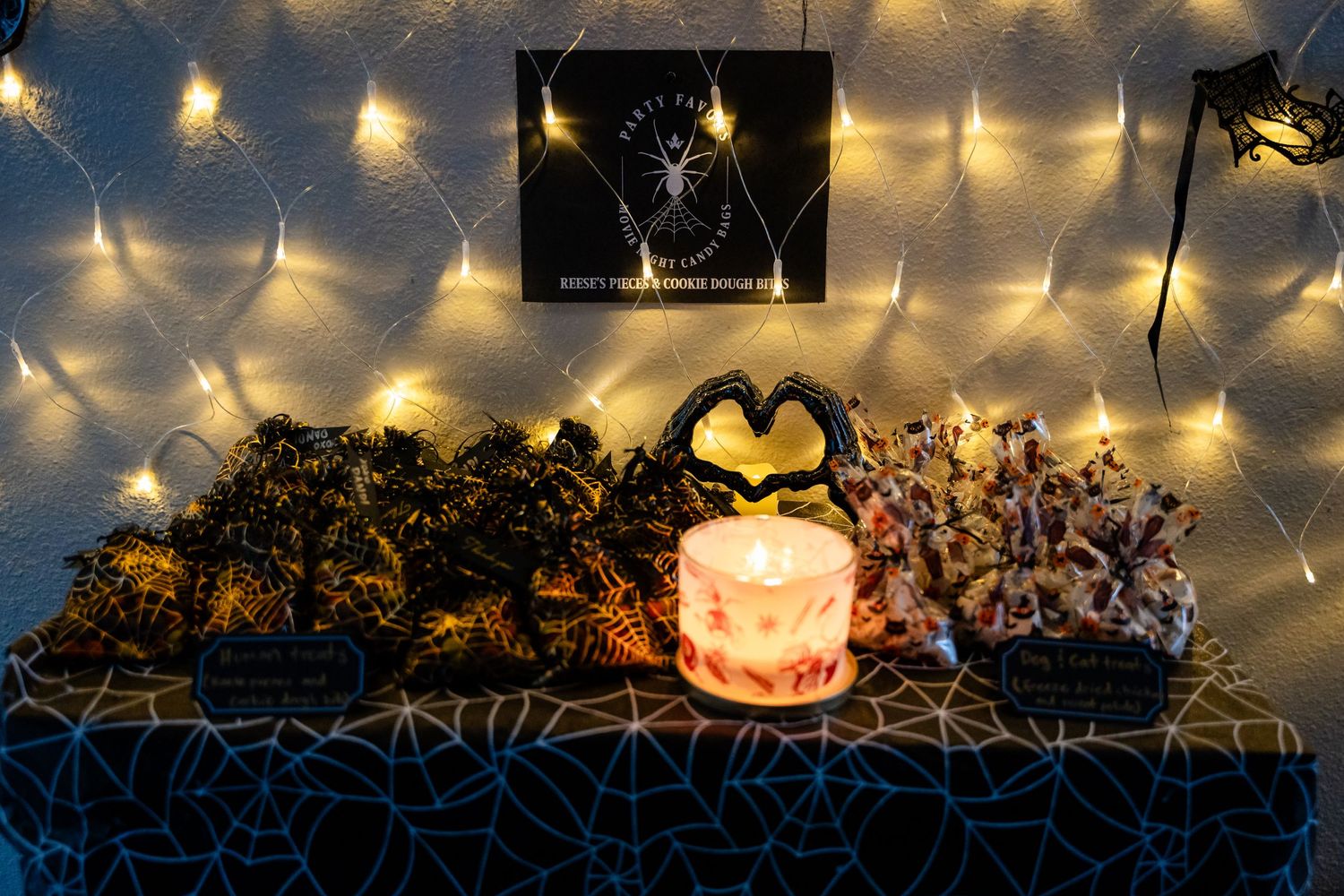 Romantic candlelit display with heart shadow and string lights creating ambient atmosphere.