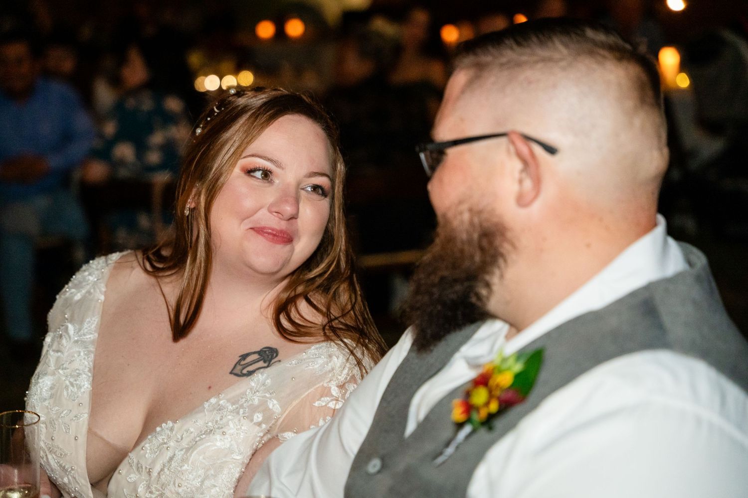 Couple sharing an intimate moment during their wedding reception.