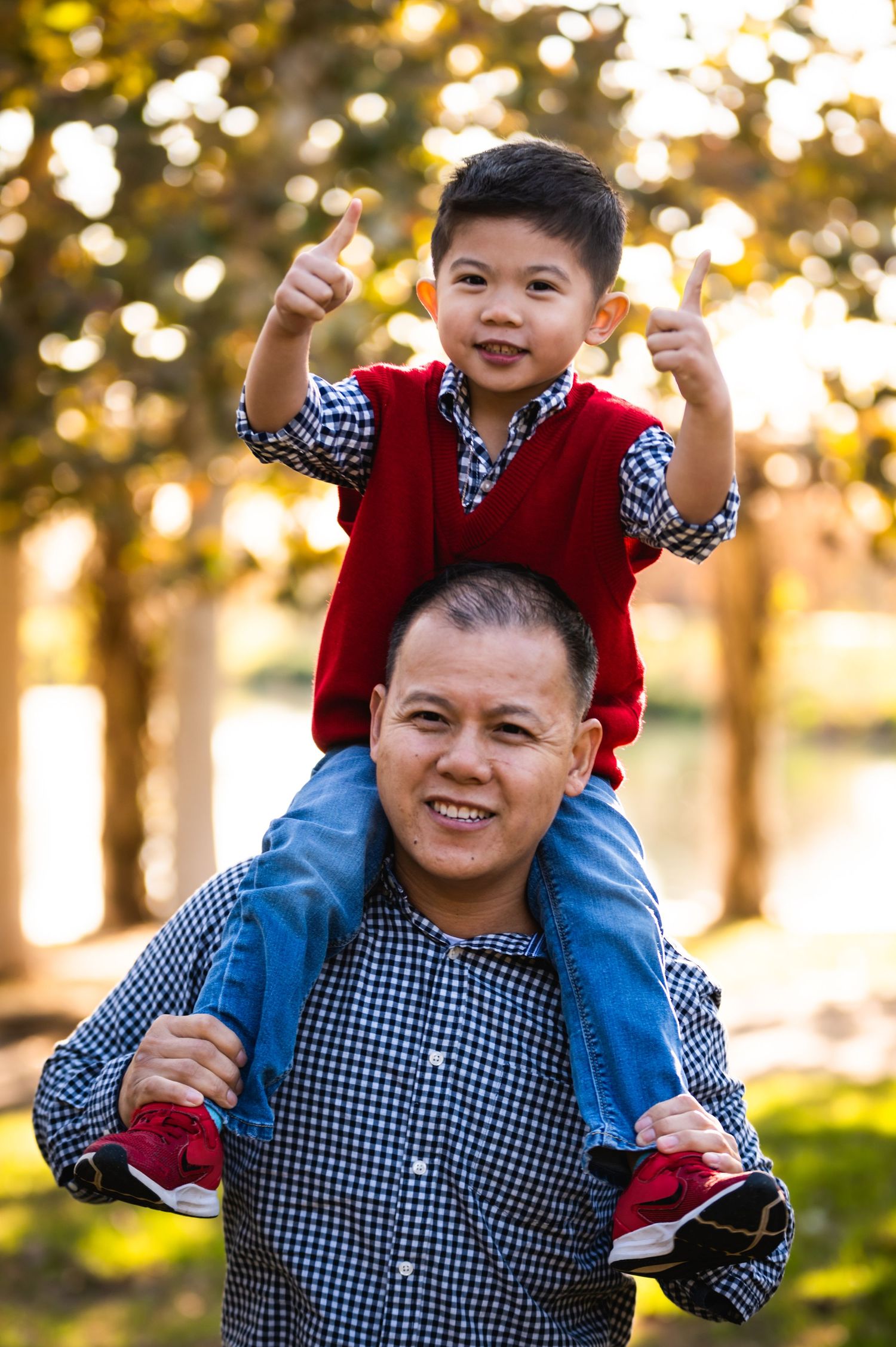 A joyful moment captured between parent and child playing outdoors at sunset.