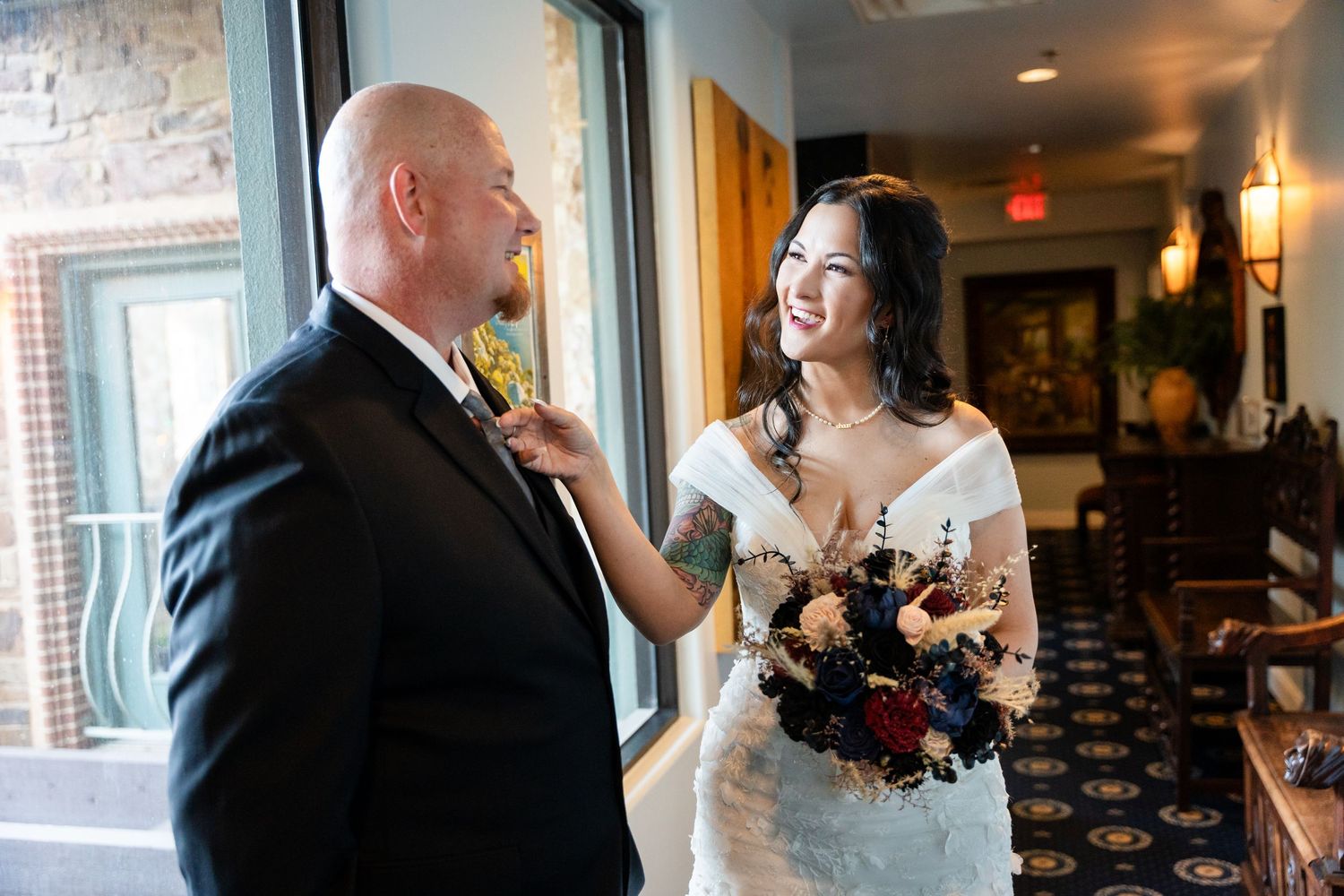 A tender moment shared between a couple during their wedding day.
