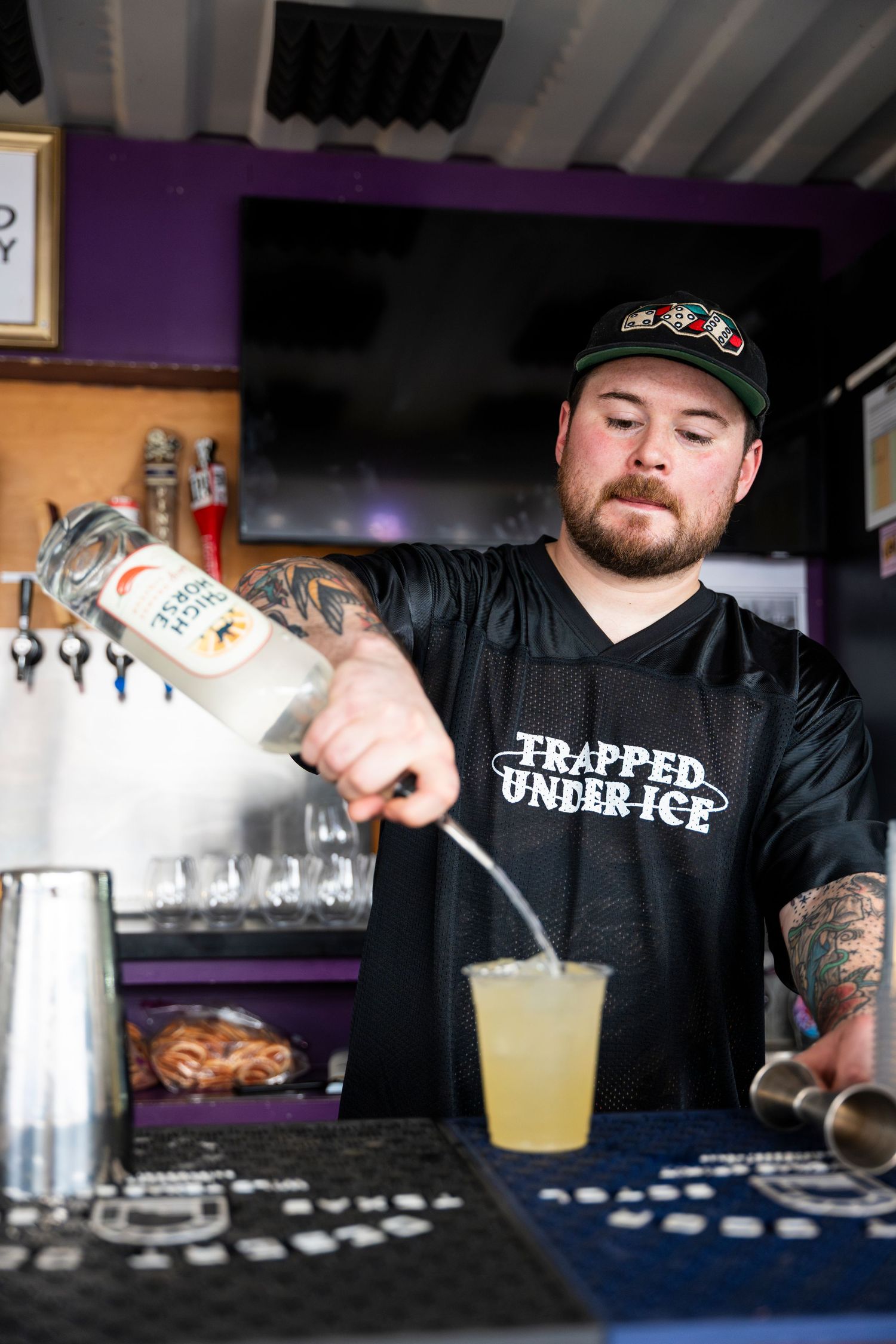 A bartender in a black 