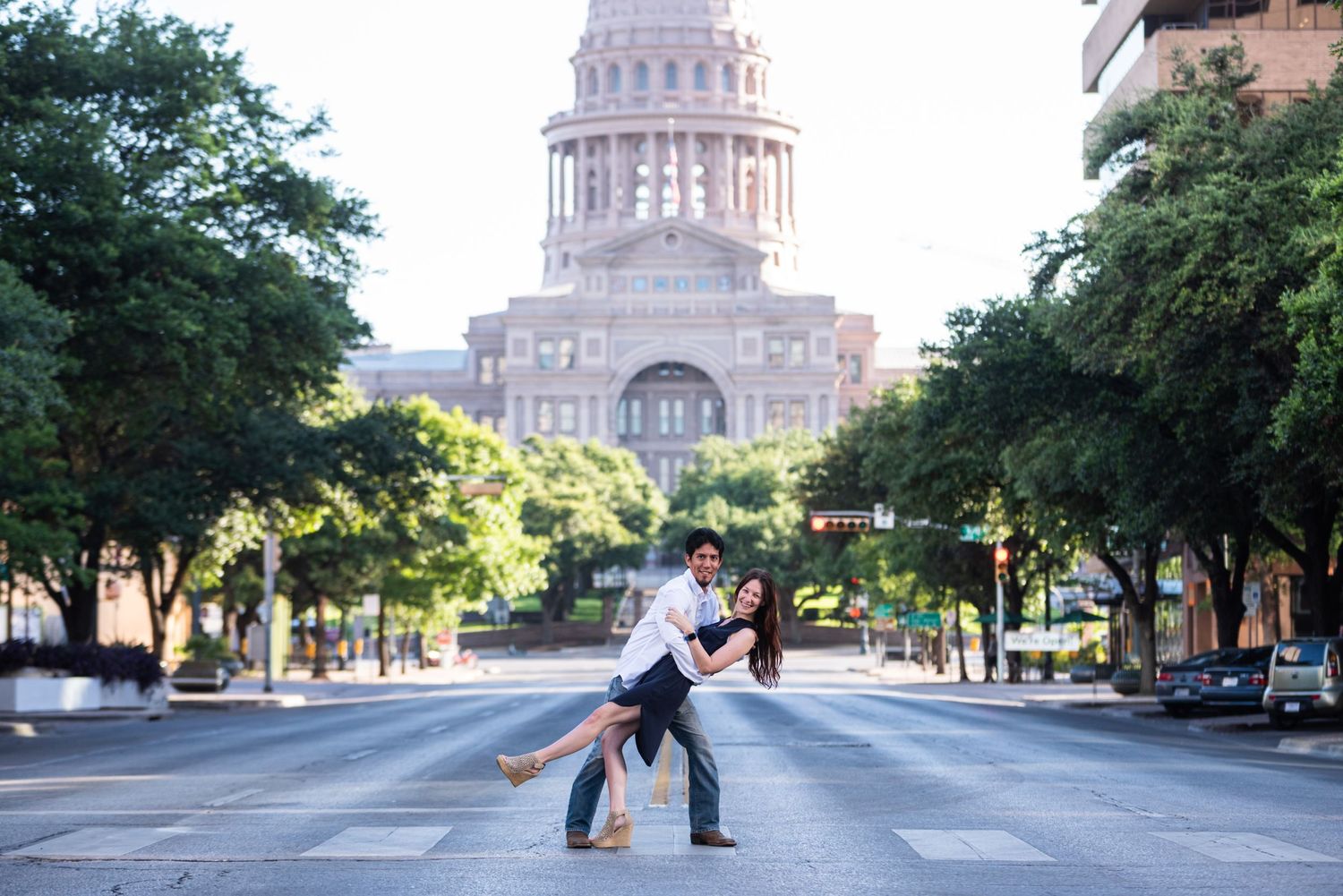 A romantic dip pose in front of the Texas State Capitol building in Austin.