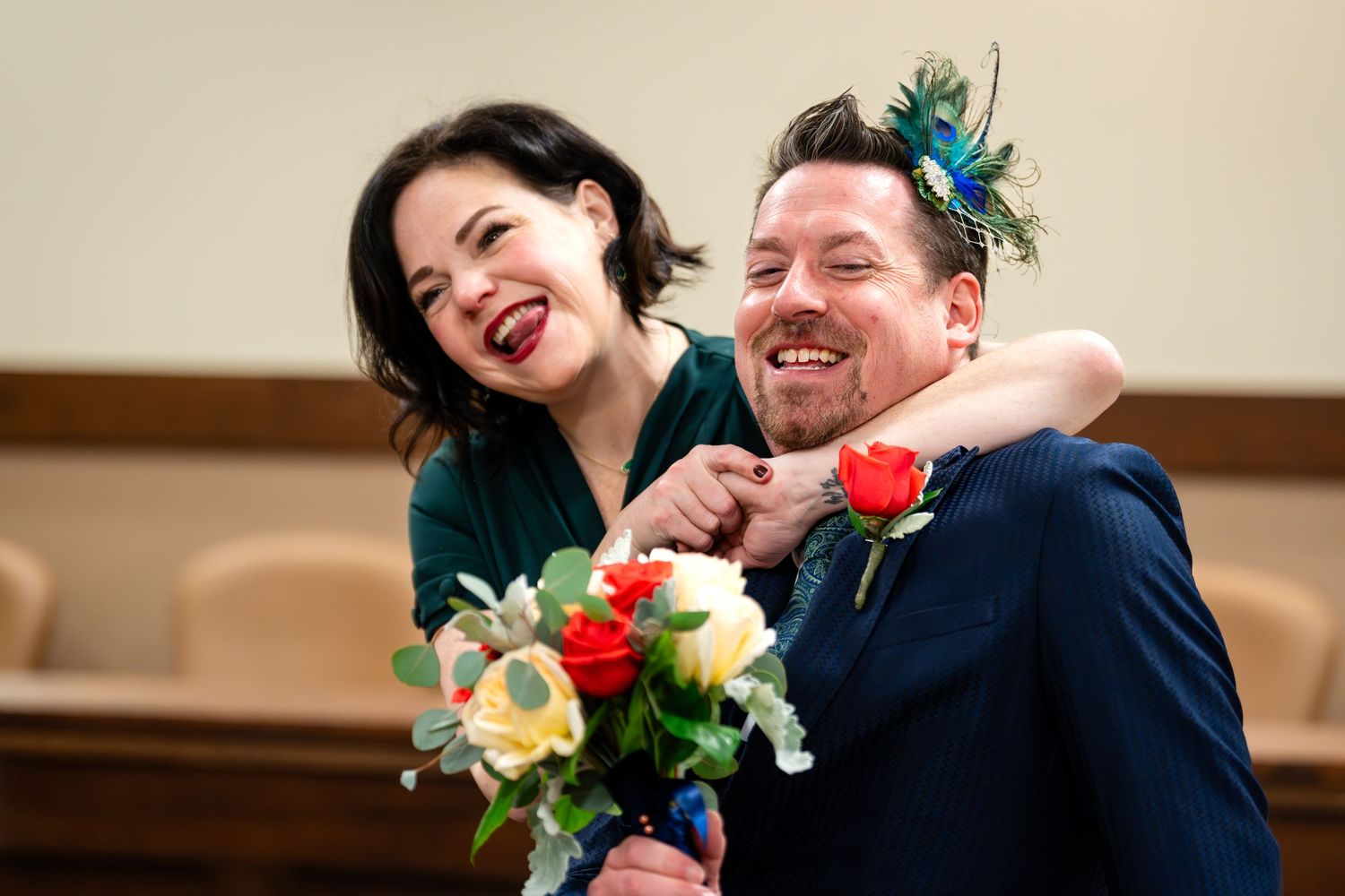 Happy couple shares joyful moment during wedding celebration.