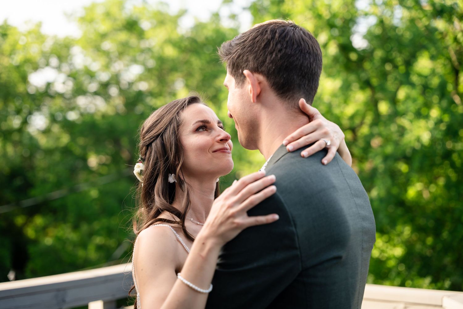 A romantic outdoor portrait of a couple sharing an intimate moment on a patio.