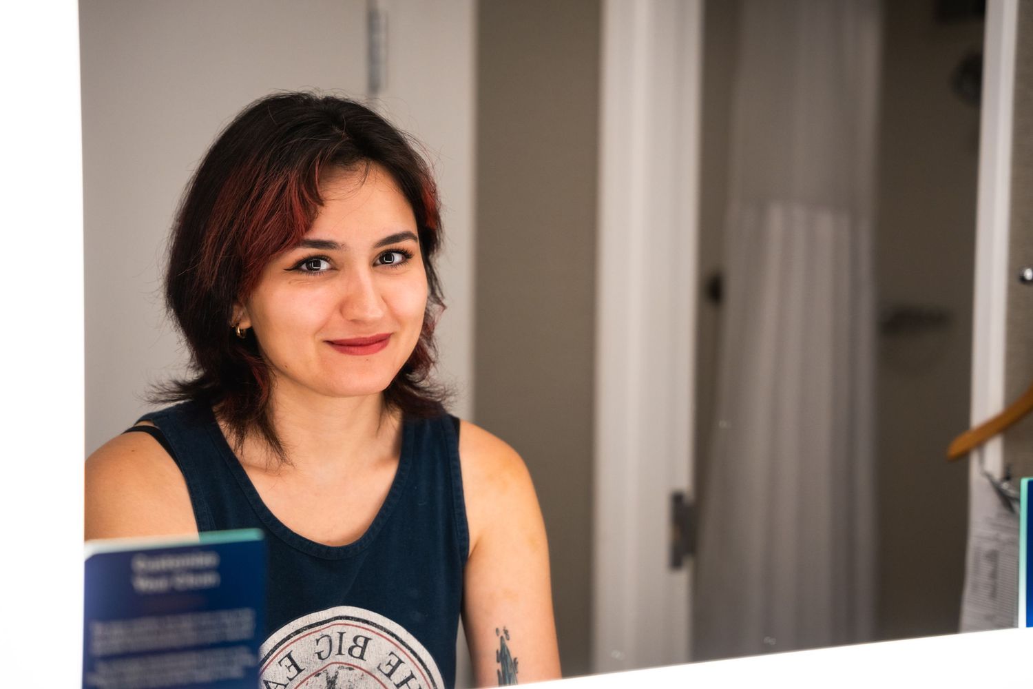 Casual portrait taken in a home setting with natural lighting.